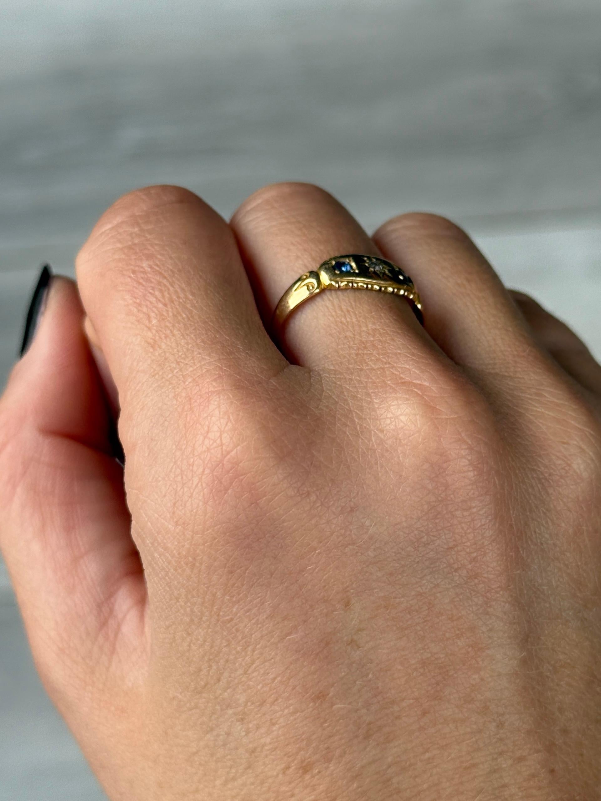 This ring holds a diamond at the centre measuring approx 5pts and two sapphires measuring 7pts each. 

Ring Size: N 1/2 or 7 
Band Width: 7mm

Weight: 1.9g