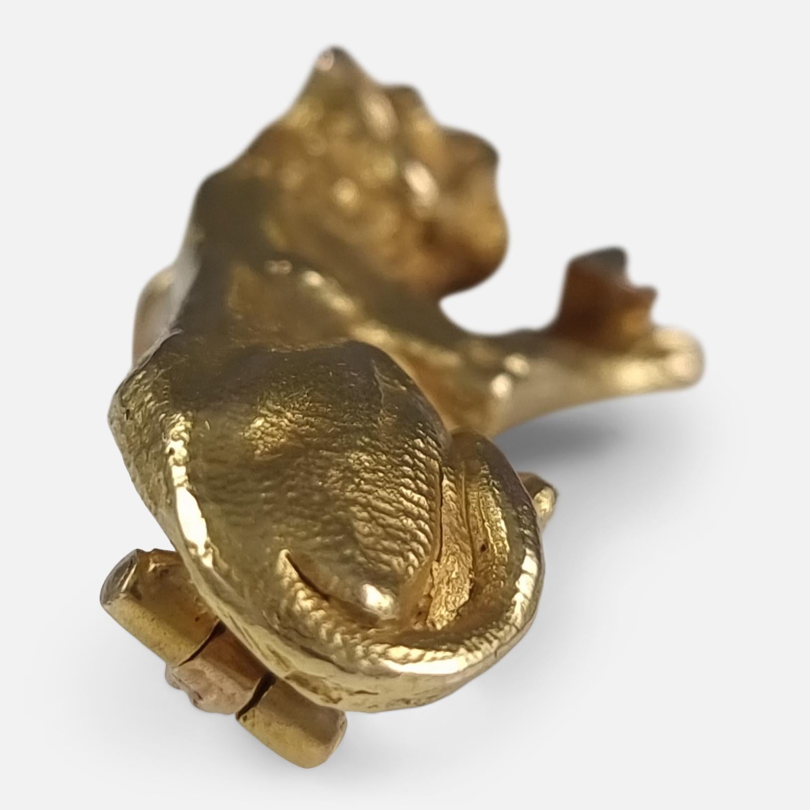 A late Victorian 18ct gold and 0.08 ct diamond lioness brooch. The brooch is crafted in the form of a lioness with an old cut diamond clasped between her paws.

As was common for the period, the brooch is unhallmarked and has been tested and