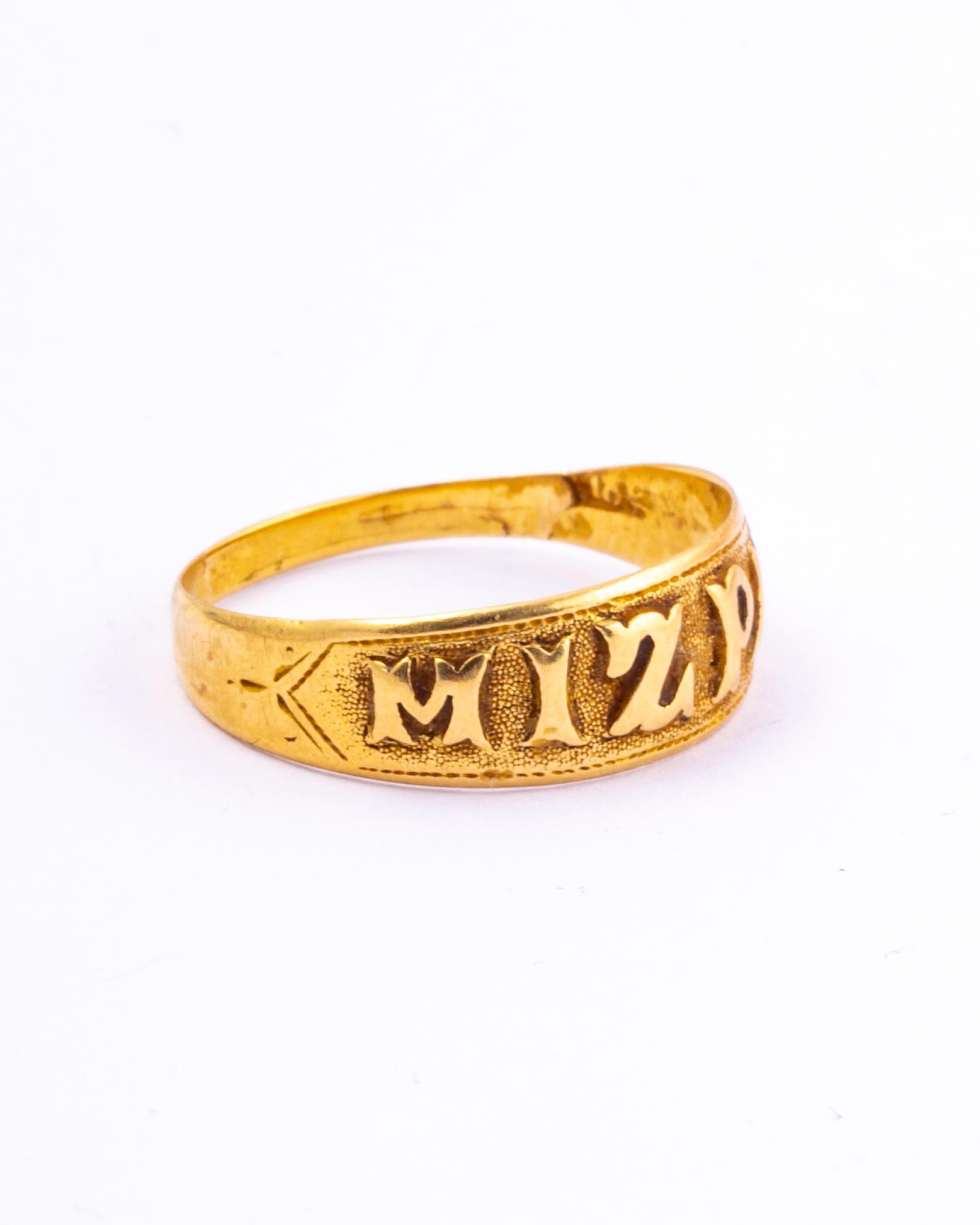 This wonderful antique ring dates from the late Victorian period. It is embossed with the word 