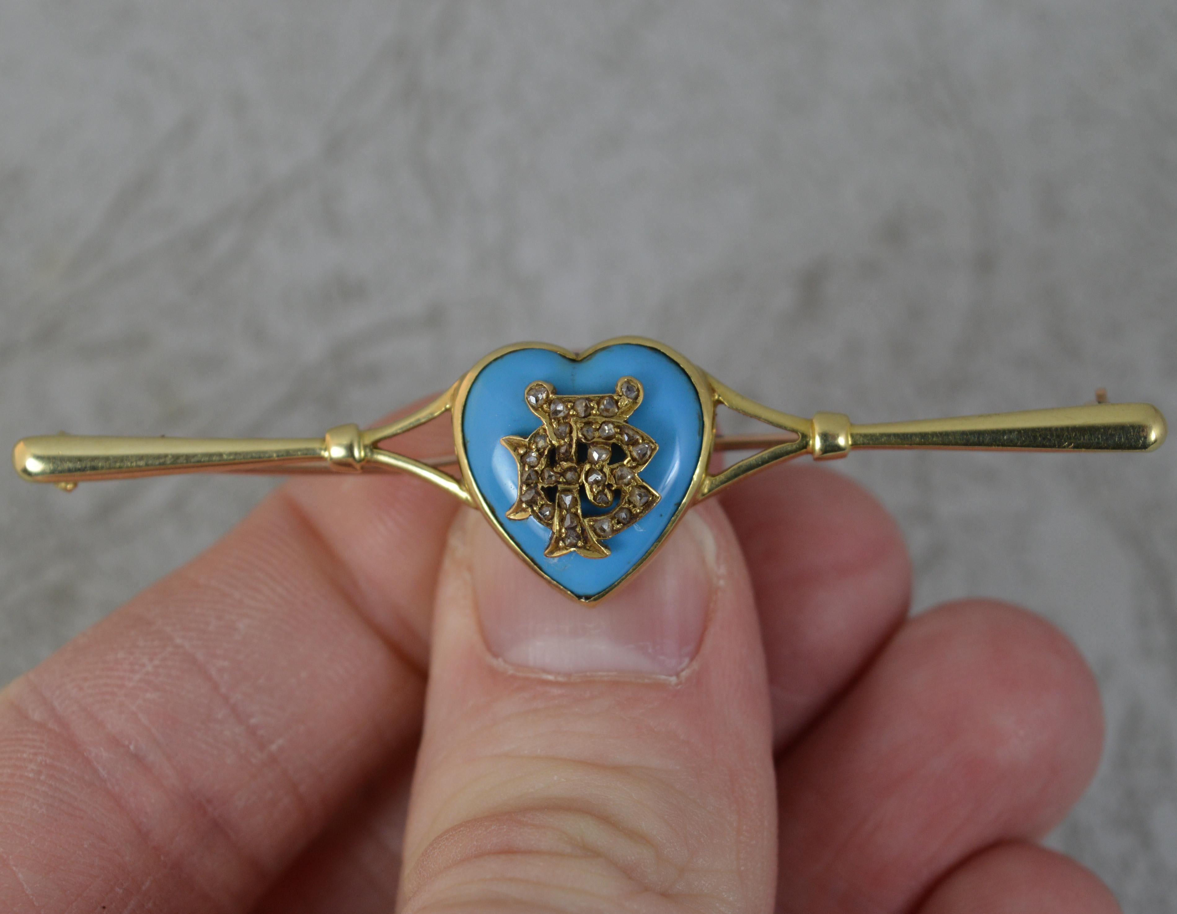 A superb late Victorian period brooch.
Solid 15 carat yellow gold bar brooch.
Designed with an 18ct gold heart to centre. The heart set with a single turquoise stone with diamond encrusted FB initials inset.

CONDITION ; Very good. Securely set
