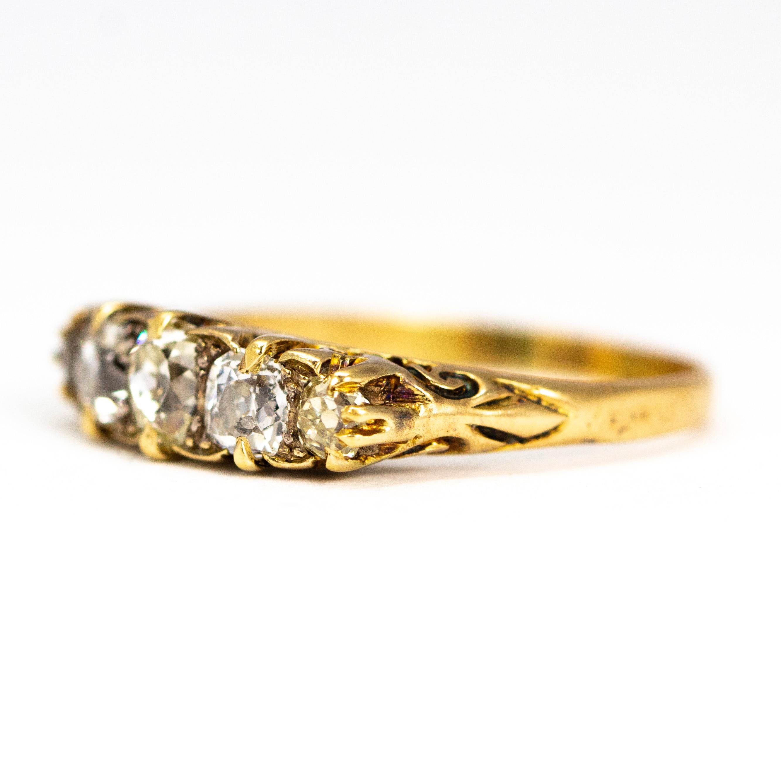 This ornate five stone ring shows off old cut diamonds totalling 1 carat. These stones are then wonderfully flattered within a beautifully delicate carved shank.

This handmade mount uses 18 carat Yellow Gold to compliment the craftsmanship of this