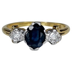 Antique Victorian 18 Karat Gold 1.45 Carat Sapphire 0.28 Carat Diamond Three Stone Ring