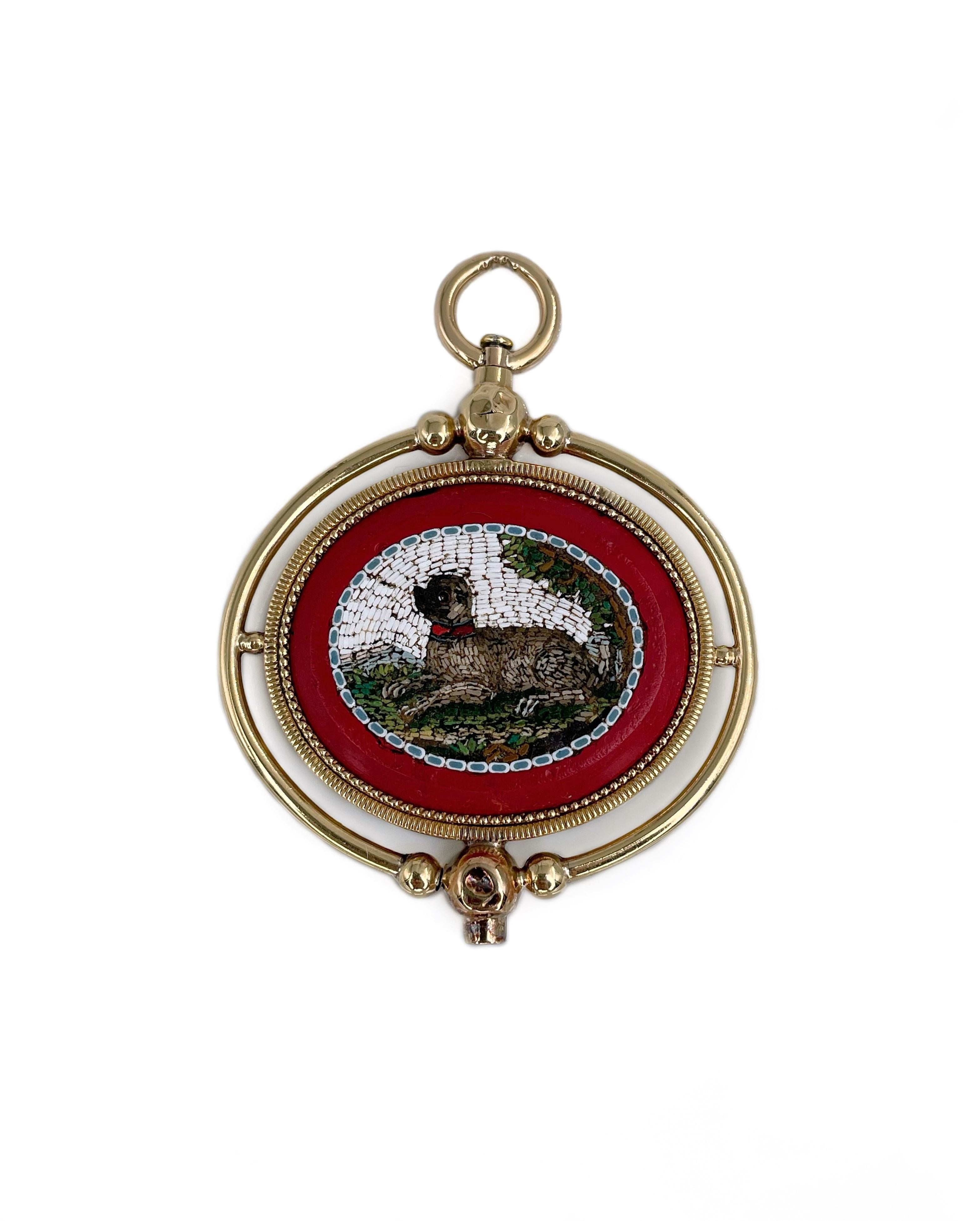 It is a lovely Victorian pocket watch key fob charm pendant crafted in 18K gold. Circa 1880. It features the detailed fauna micro mosaics on both sides. One is depicting two birds, another - a dog. 

Weight: 18.25g
Size: 5.5x4.2cm

———

If you have