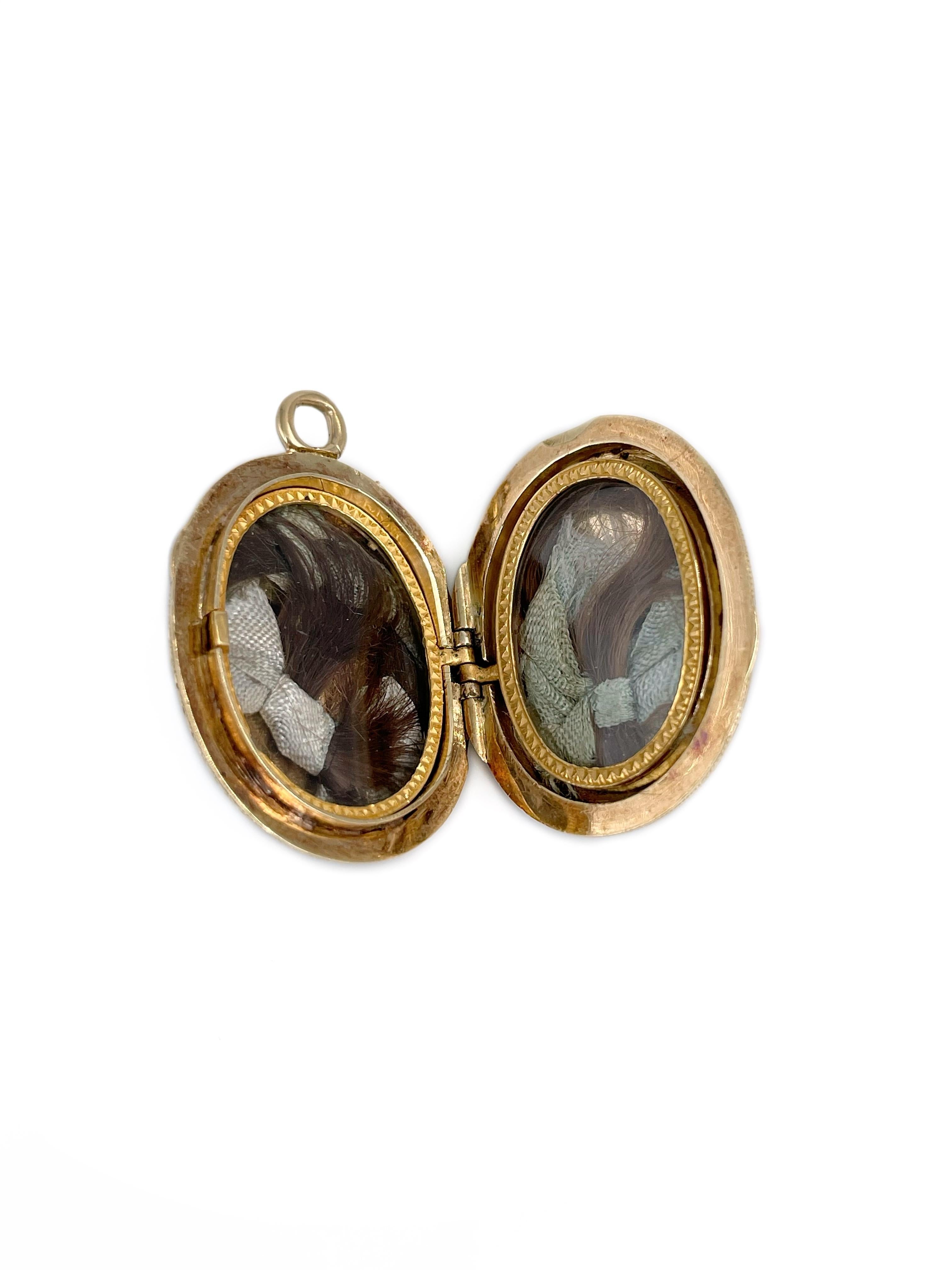 This is an amazing Victorian oval locket pendant crafted in 18K yellow gold. Circa 1880. 

The piece is adorned with black enamel stripes. There are initials (possibly letters “A” and “C” or “G”) encrusted with rose cut diamonds. Back side is