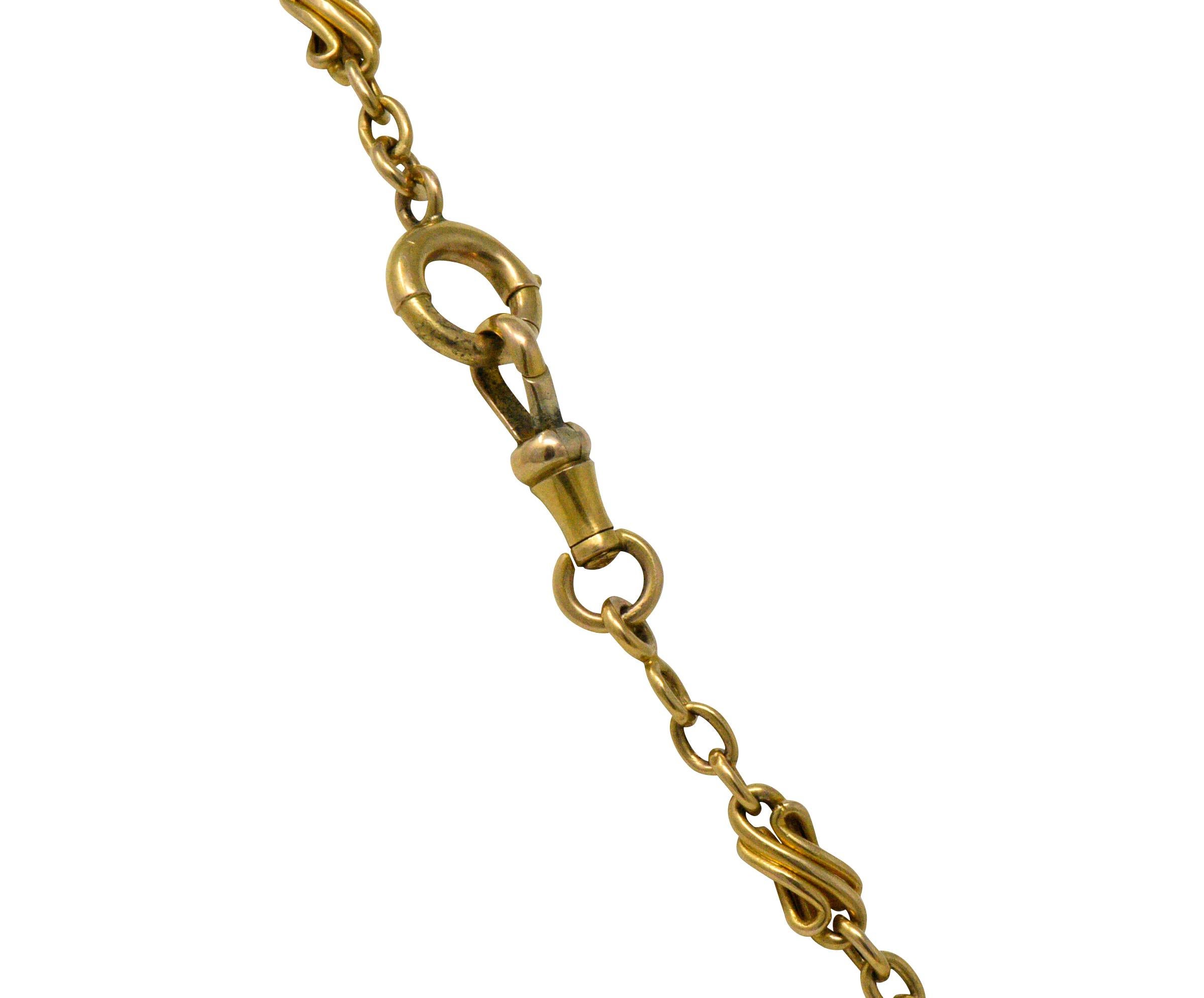Long-chain necklace comprised of decorative swiveled links alternating with jump ring spacer links

Completed by hinged clasp

With French assay marks for 18 karat gold

Length: 62 1/2 inches

Width at widest: 5.2 mm 

Total weight: 36.1