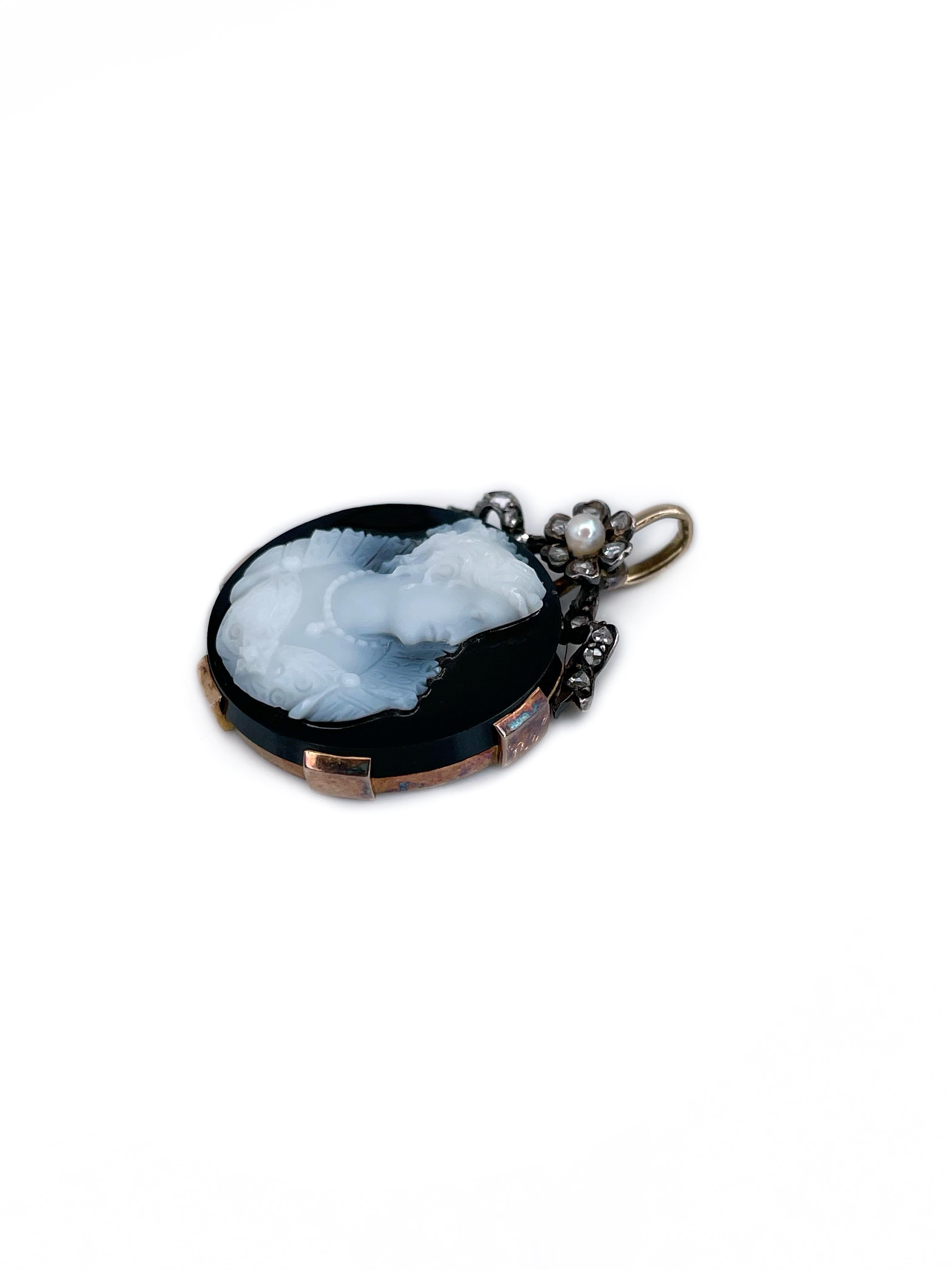 This is a Victorian pendant crafted in 18K gold. Circa 1890. 

It features an onyx cameo depicting a lady. The piece is adorned with rose cut diamonds and a pearl.  

There are some kind of numbers carved on the back side. 

Weight: 5.73g
Size: