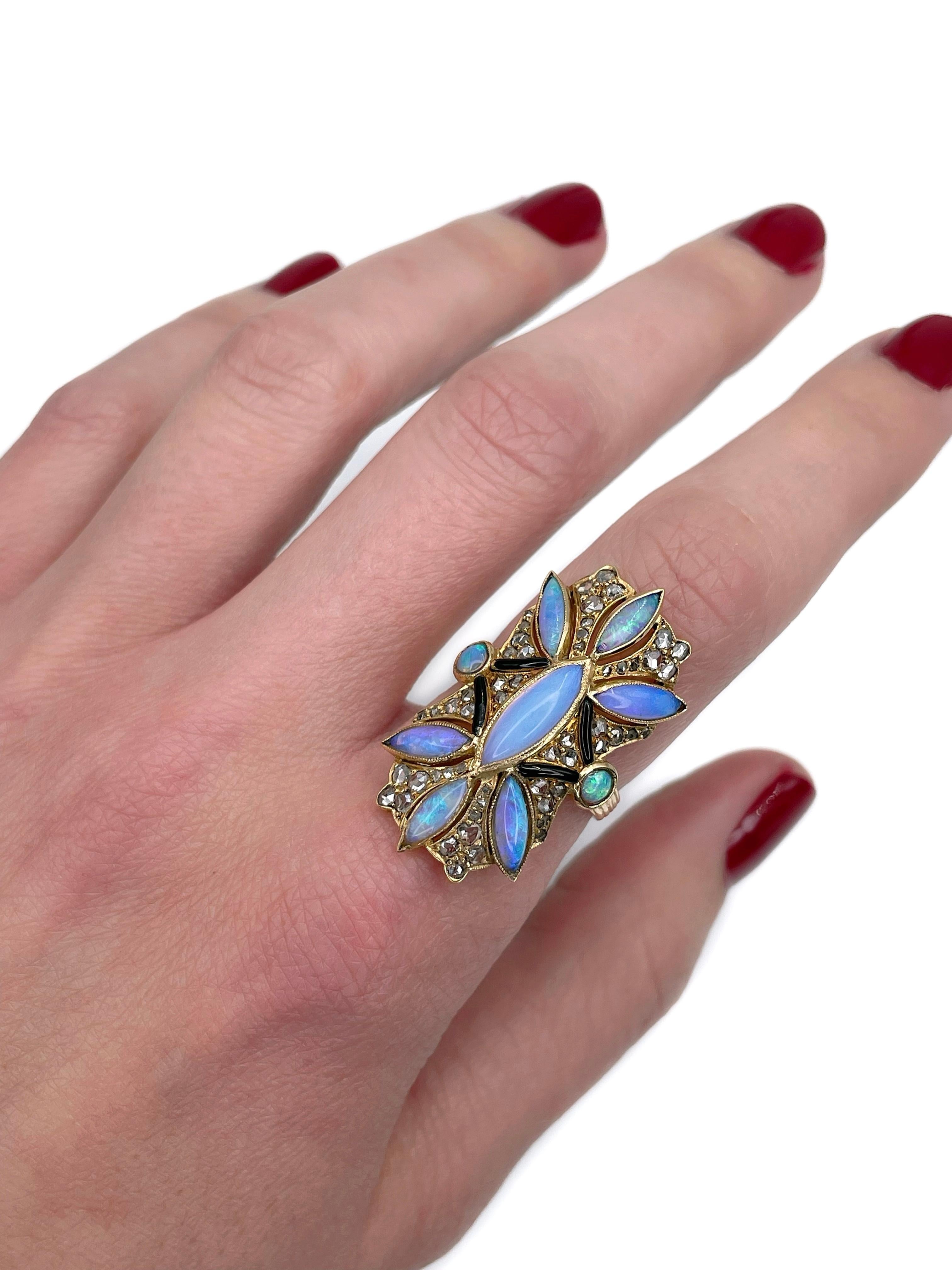 This is a stunning Victorian cocktail ring crafted in 18K gold. Circa 1890. It features opals, rose cut diamonds and black enamel. 

Weight: 7.49g 
Size: 17.25 (US 6.75)

IMPORTANT: please ask about the possibility to resize before purchase. This