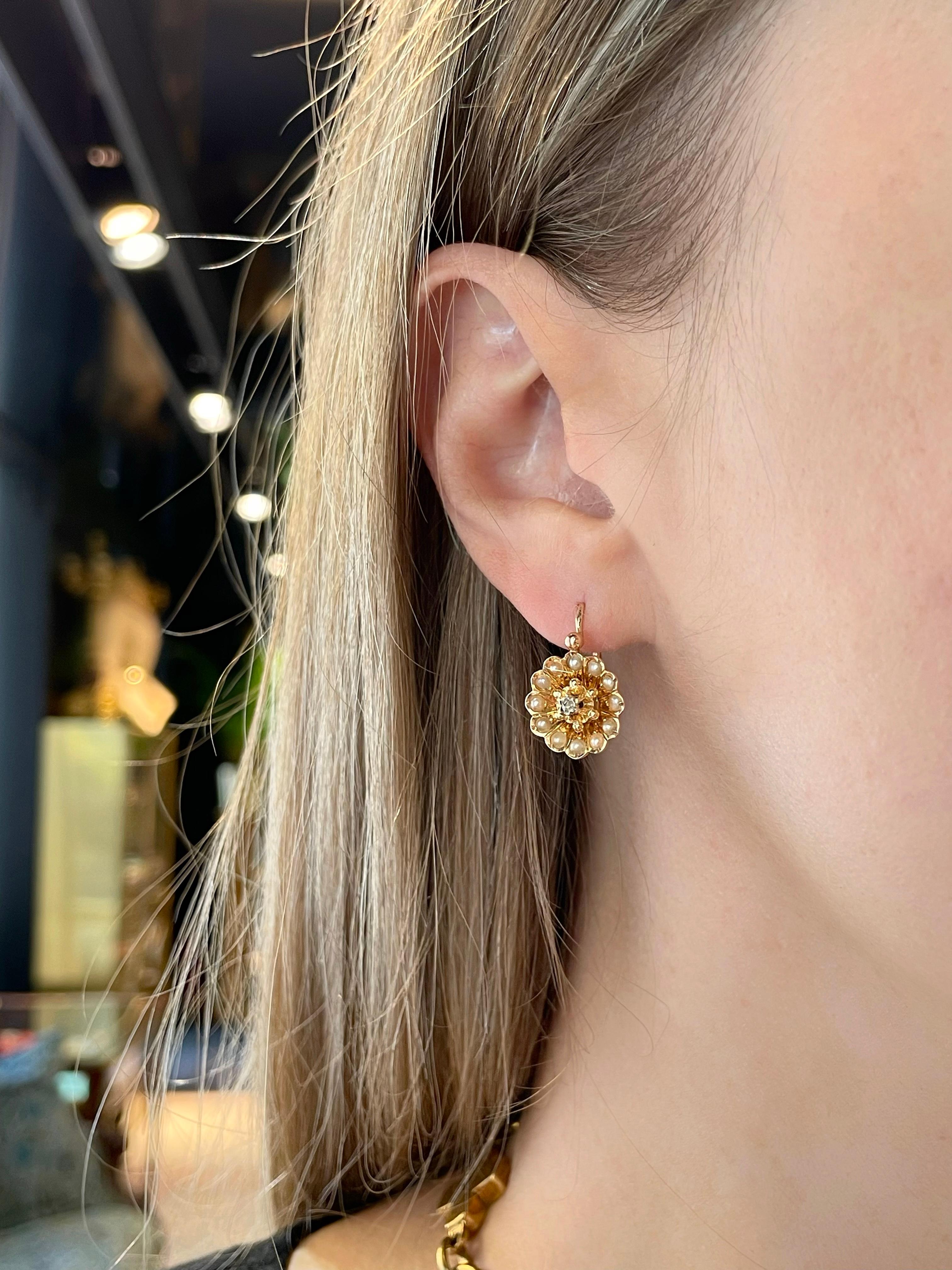 It is a lovely pair of Victorian front fastening cluster earrings. The piece is crafted in 18K gold. Circa 1880.

The piece features rose cut diamonds and seed pearls. 

Weight: 3.59g
Length: 2cm 
Diameter: 1.2cm

———

If you have any questions,