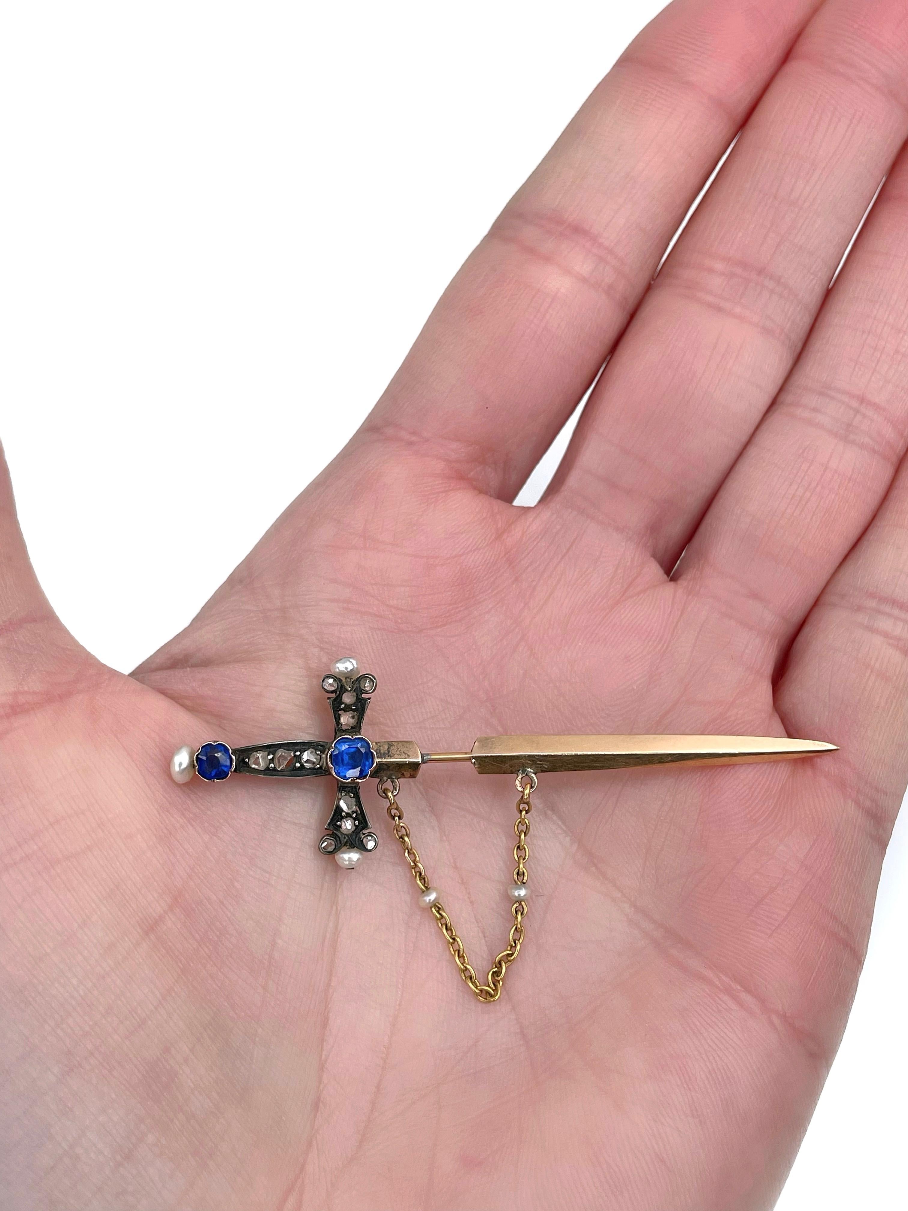 This is a Victorian bejeweled jabot sword stick pin brooch. It is crafted in 18K gold. Circa 1900. The piece features rose cut diamonds and seed pearls. 

Weight: 2.93g
Length: 6cm
Chain length: 4.5cm

———

If you have any questions, please feel