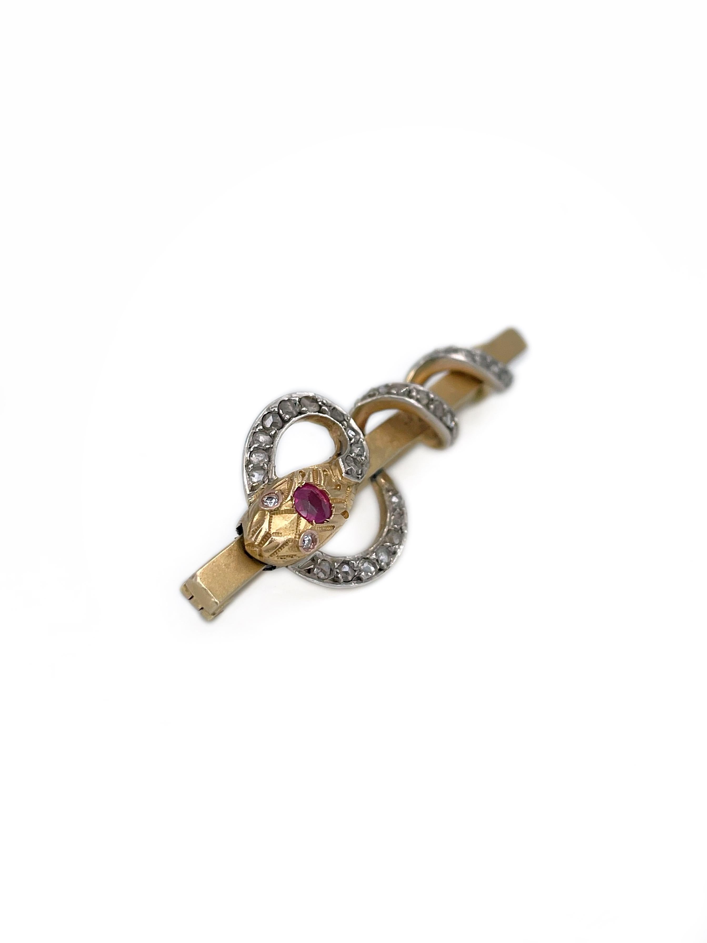 This is a Victorian snake bar brooch crafted in 18K gold.  Circa 1890.

The piece features ruby and rose cut diamonds. Eyes are encrusted with 2 round cut diamonds. 

Has a C clasp. 

Serpents were highly symbolic during the Victorian era, often