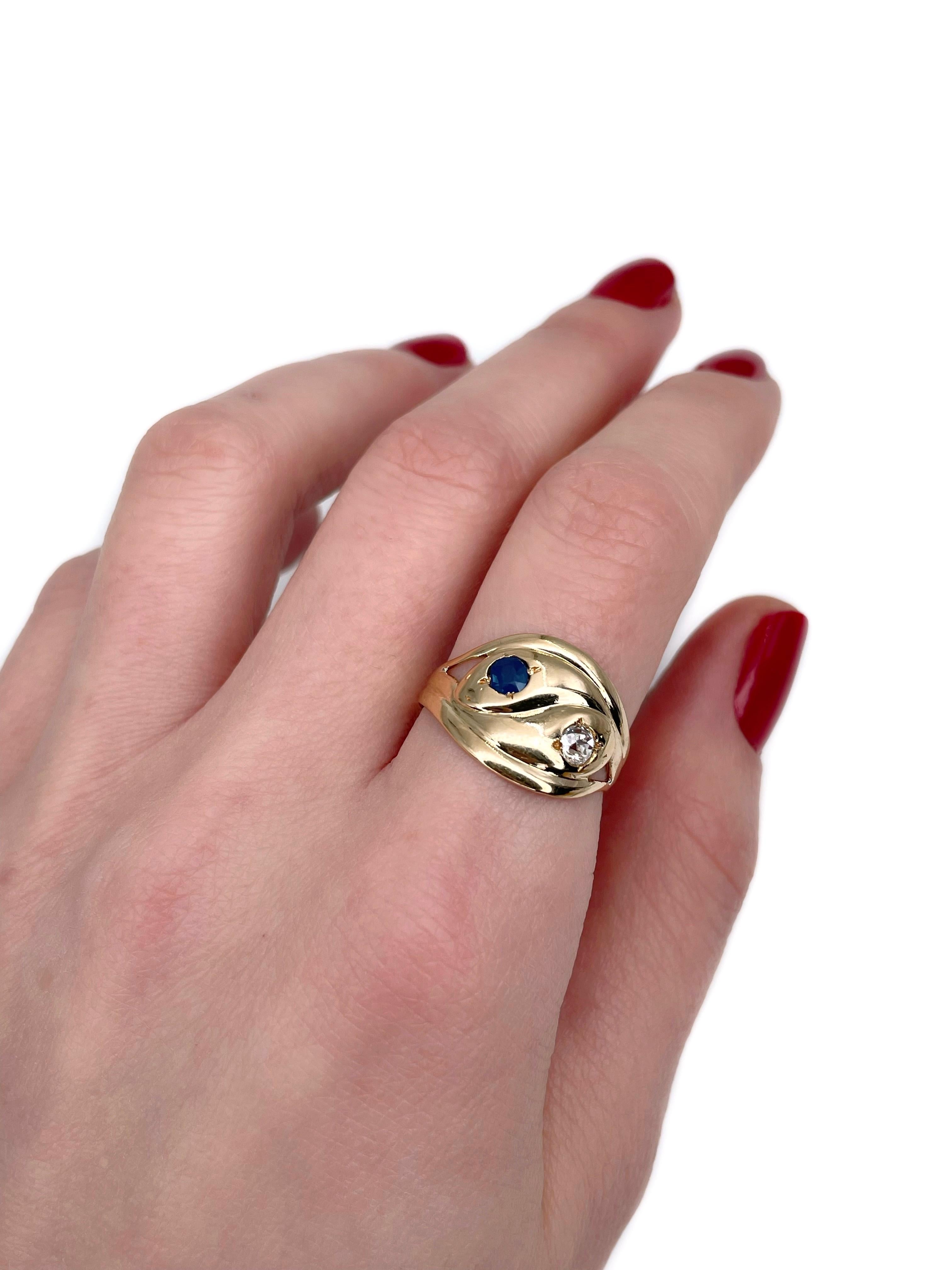 This is a lovely Victorian double snake ring crafted in 14K yellow gold. Circa 1890. 

The piece features:
- 1 sapphire, round cut, 0.22ct, B 6/3, VS
- 1 diamond, old mine cut, 0.20ct, W-STW, VS

Weight: 4.45g
Size: 18.5 (US 8.25)

IMPORTANT: please