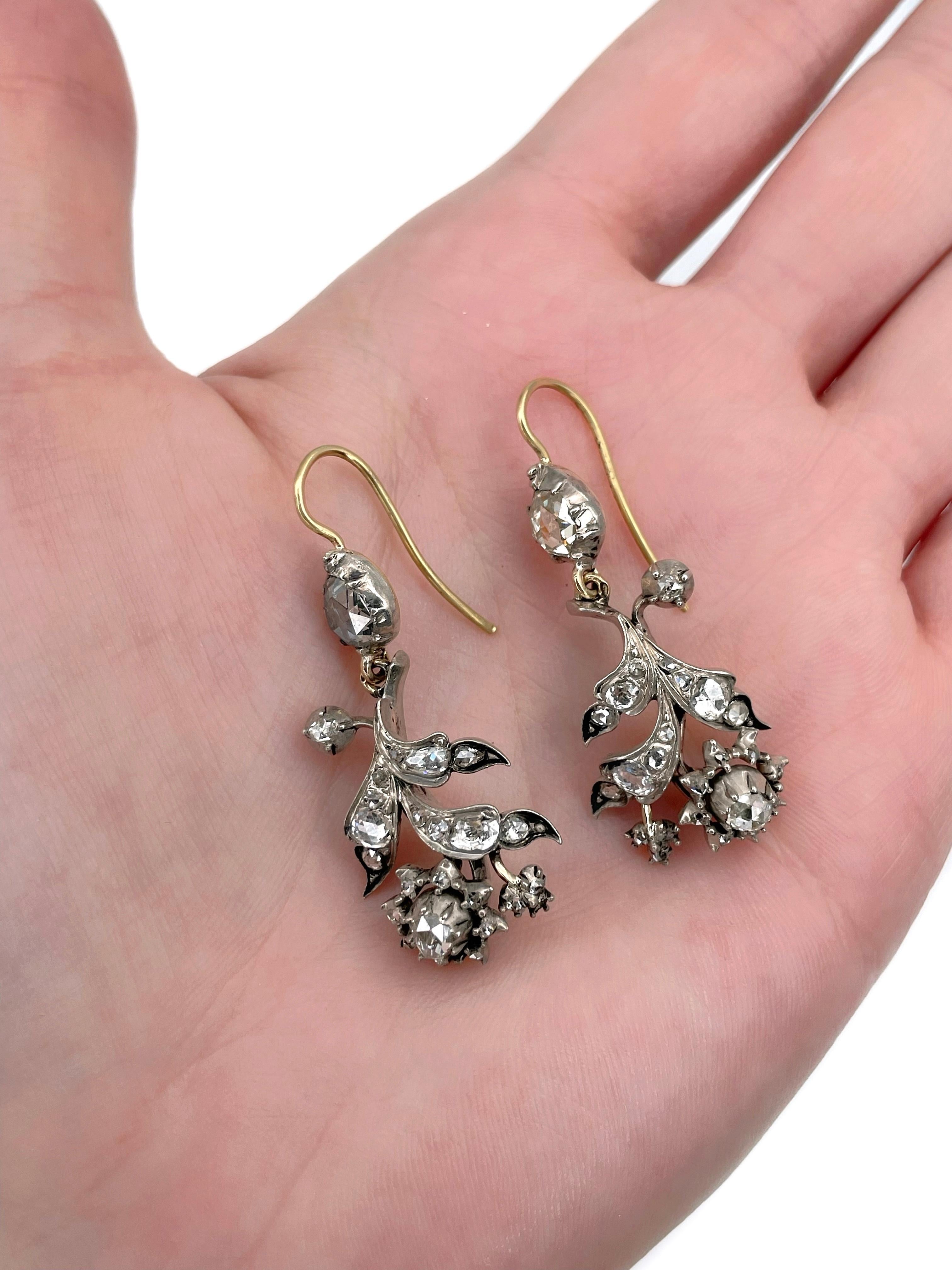 It is a lovely pair of Victorian floral dangle earrings crafted in 18K gold and adorned with silver. Circa 1880.

The piece features rose cut diamonds. 

Weight: 9.39g
Length: 4.2cm 

———

If you have any questions, please feel free to ask. We