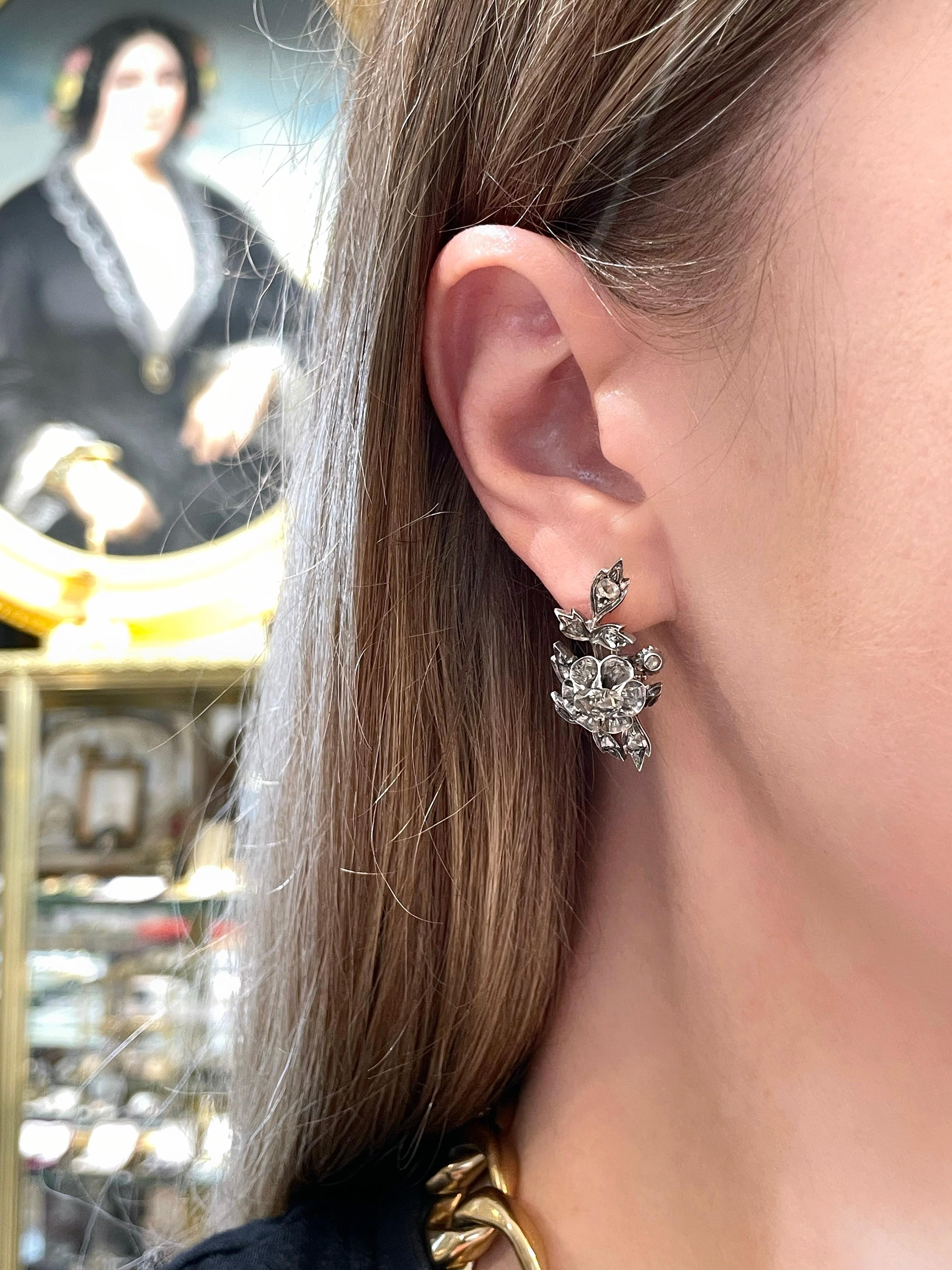 This is a lovely pair of a Victorian floral lever-back earrings. It is crafted in 18K gold and silver. The piece features rose cut diamonds. Circa 1890. 

Weight: 7.81g
Length: 3cm 

IMPORTANT: As a buyer, you are fully responsible for the customs