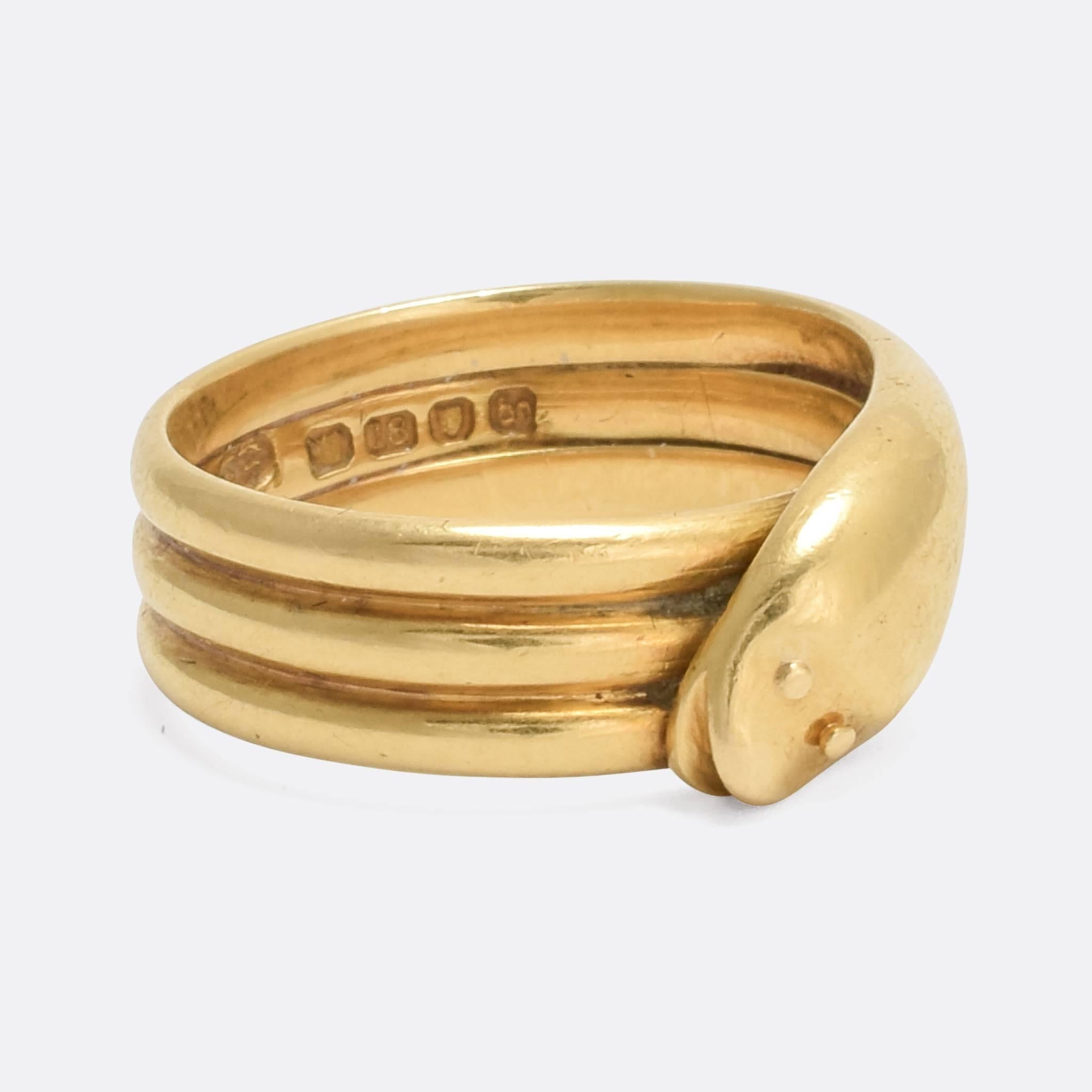 A super cute antique snake ring, modelled in rich 18 karat yellow gold. With London hallmarks for the year 1873, the snake has a goofy face, beady eyes, and relatively slim profile given it curves around the finger three times.

RING SIZE
6