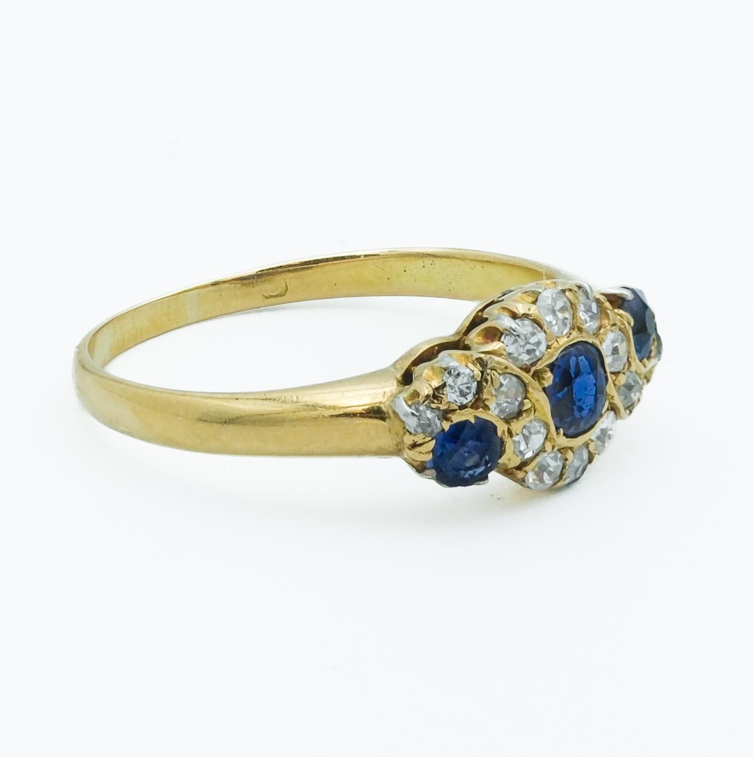 Victorian 18 Karat Royal Blue Sapphire and Diamond Three Stone Cluster Ring In Good Condition For Sale In Fairfield, CT