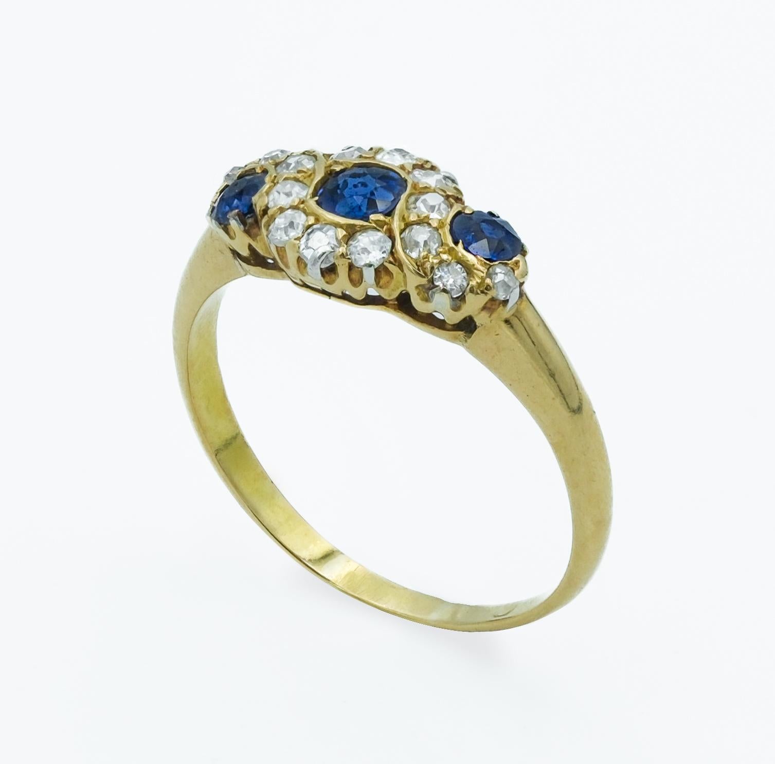 Women's Victorian 18 Karat Royal Blue Sapphire and Diamond Three Stone Cluster Ring For Sale