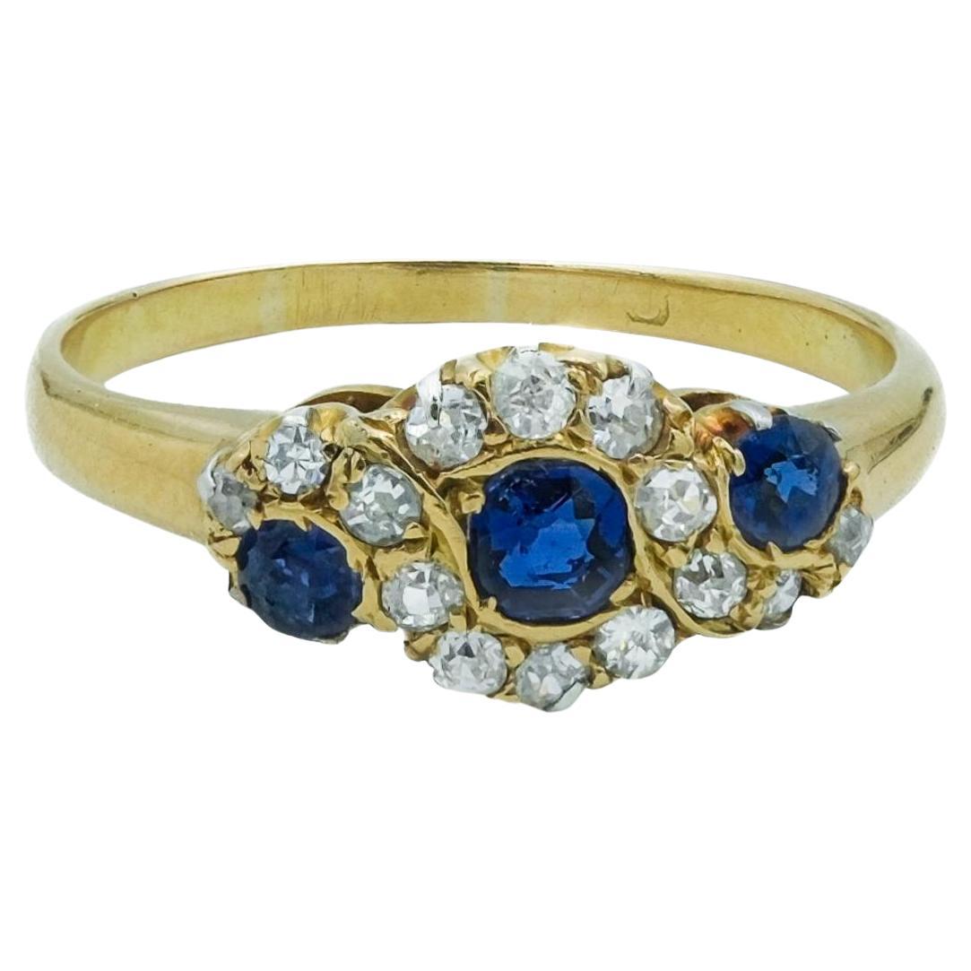 Victorian 18 Karat Royal Blue Sapphire and Diamond Three Stone Cluster Ring For Sale