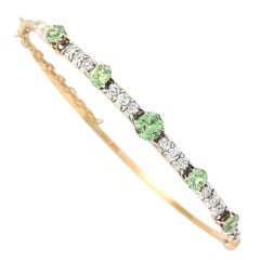 Victorian 18 Karat Yellow Gold Peridot and 1.05ct Diamond Bangle, circa 1880