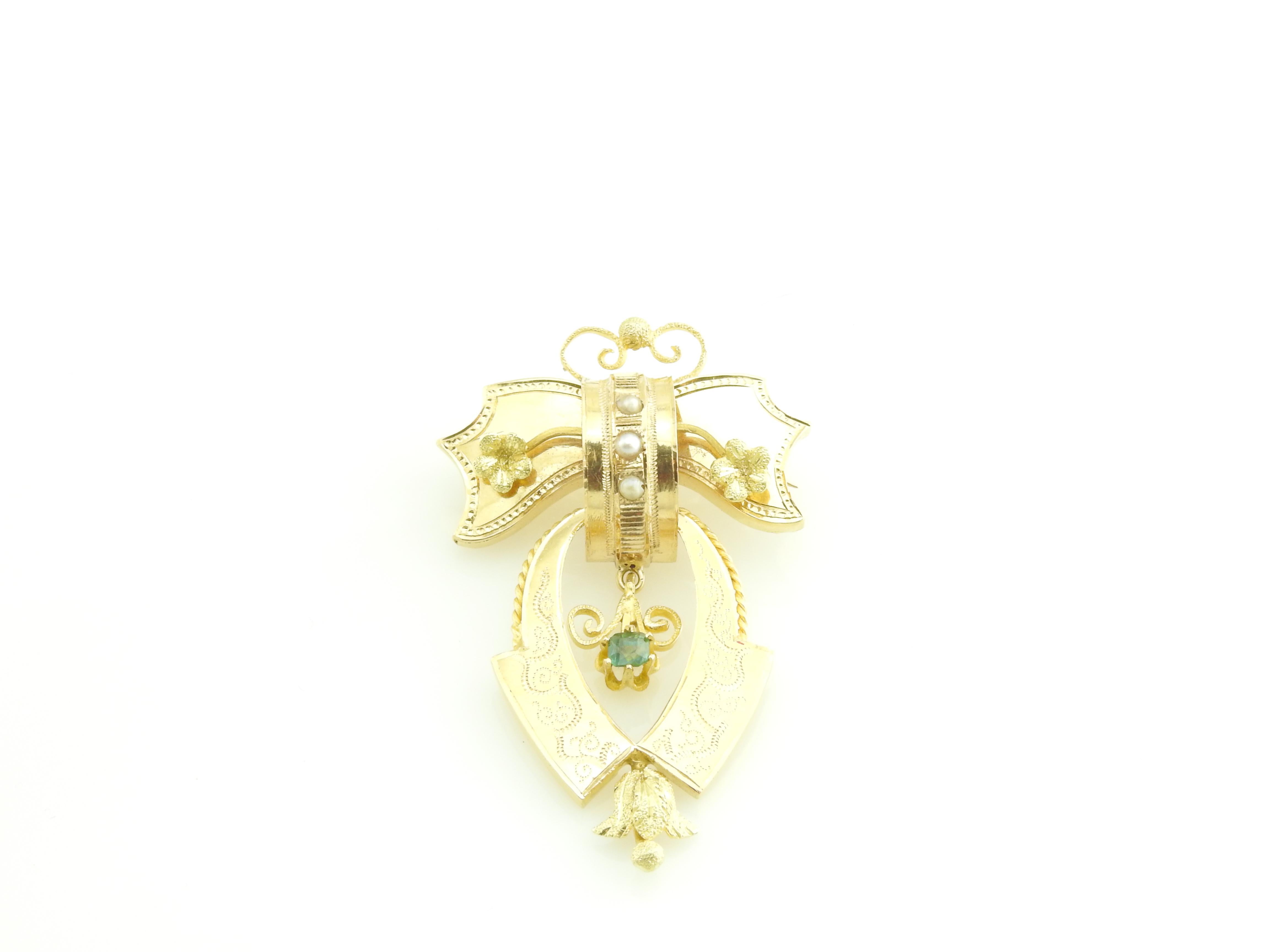 Antique Victorian 18 Karat Yellow Gold Brooch / Pin

This stunning bow brooch features three seed pearls and one blue topaz set in beautifully detailed 18K yellow gold.

Size: 48 mm x 30 mm

Weight: 4.7 dwt. / 7.4 gr.

Acid tested for 18K