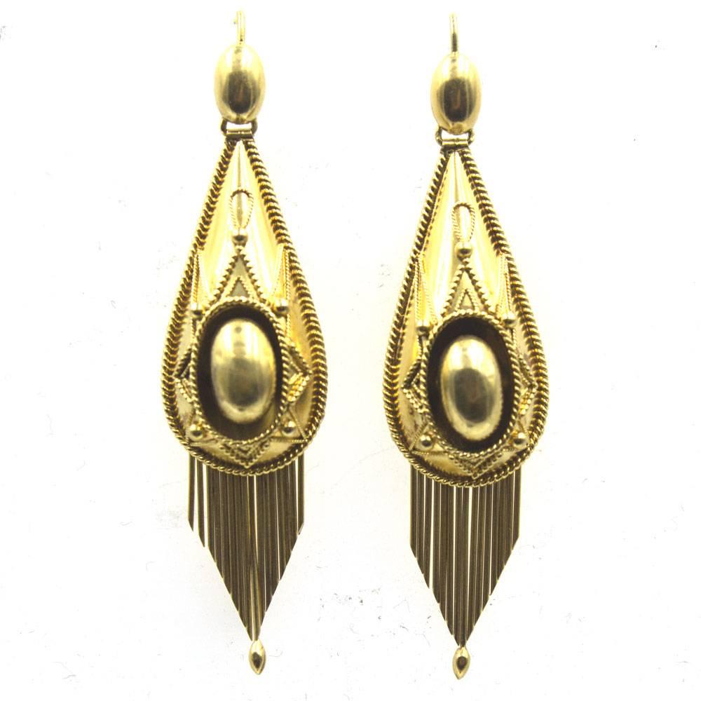 Elegant and stylish Victorian dangle earrings circa 1880's.  Fashioned in 18 karat yellow gold, these true antique earrings are in excellent condition with all the drop tassels present. The earrings measure 2.25 inches in length and .60 inches in
