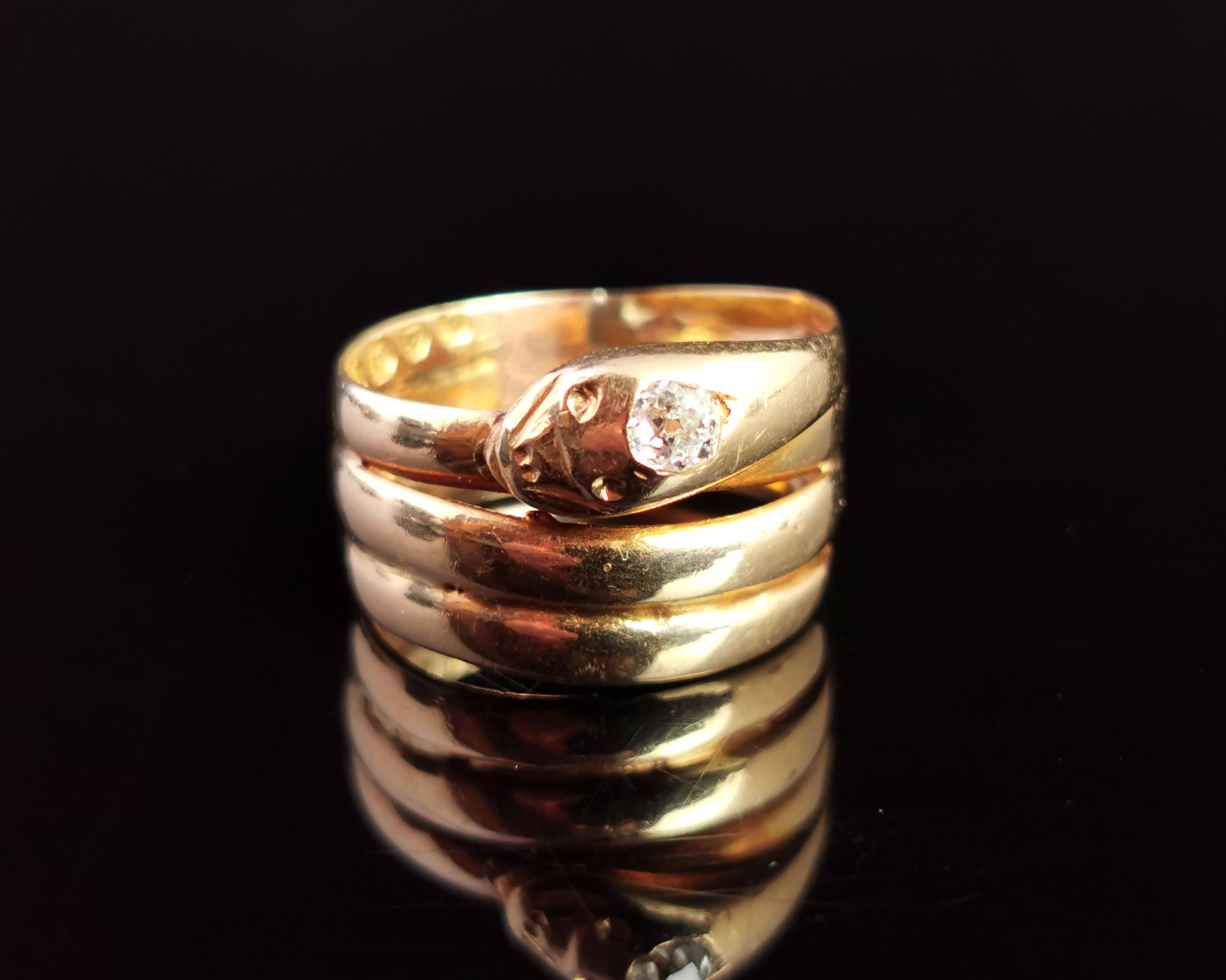 An impeccable antique, Mid Victorian diamond snake ring.

Coils and coils of rich buttery 18 karat, antique yellow gold forming the body of this handsome chap, the head is modelled at the top of the ring with the snake having engraved eyes and