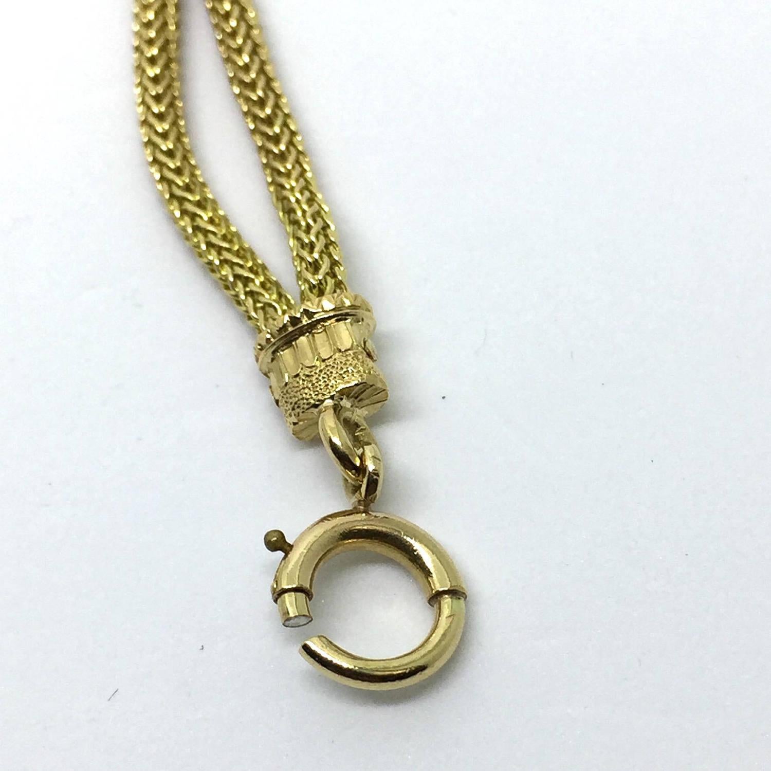 Victorian 18 Karat Yellow Gold Fob and Watch Winder Key

This elegant piece features a fob and watch winder key on a 18K gold chain. The fob is detailed with a bloodstone measuring 9 mm and accented with one round brilliant diamond and one rose cut