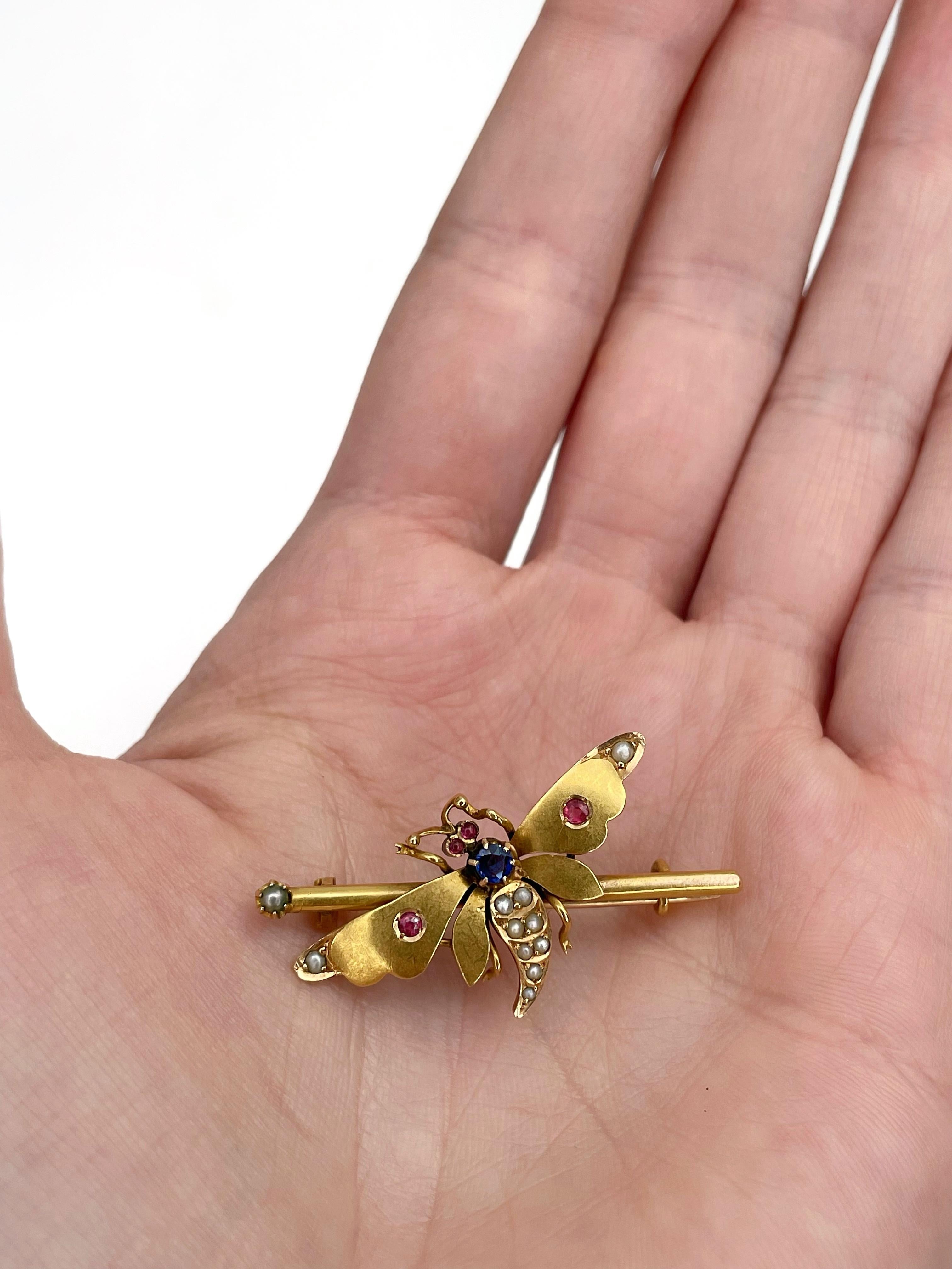 This is a lovely butterfly or dragonfly bar brooch crafted in 18K yellow gold. It features seed pearls and colourful paste.  

Weight: 3.27g
Size: 3.5x1.7cm

———

If you have any questions, please feel free to ask. We describe our items accurately.