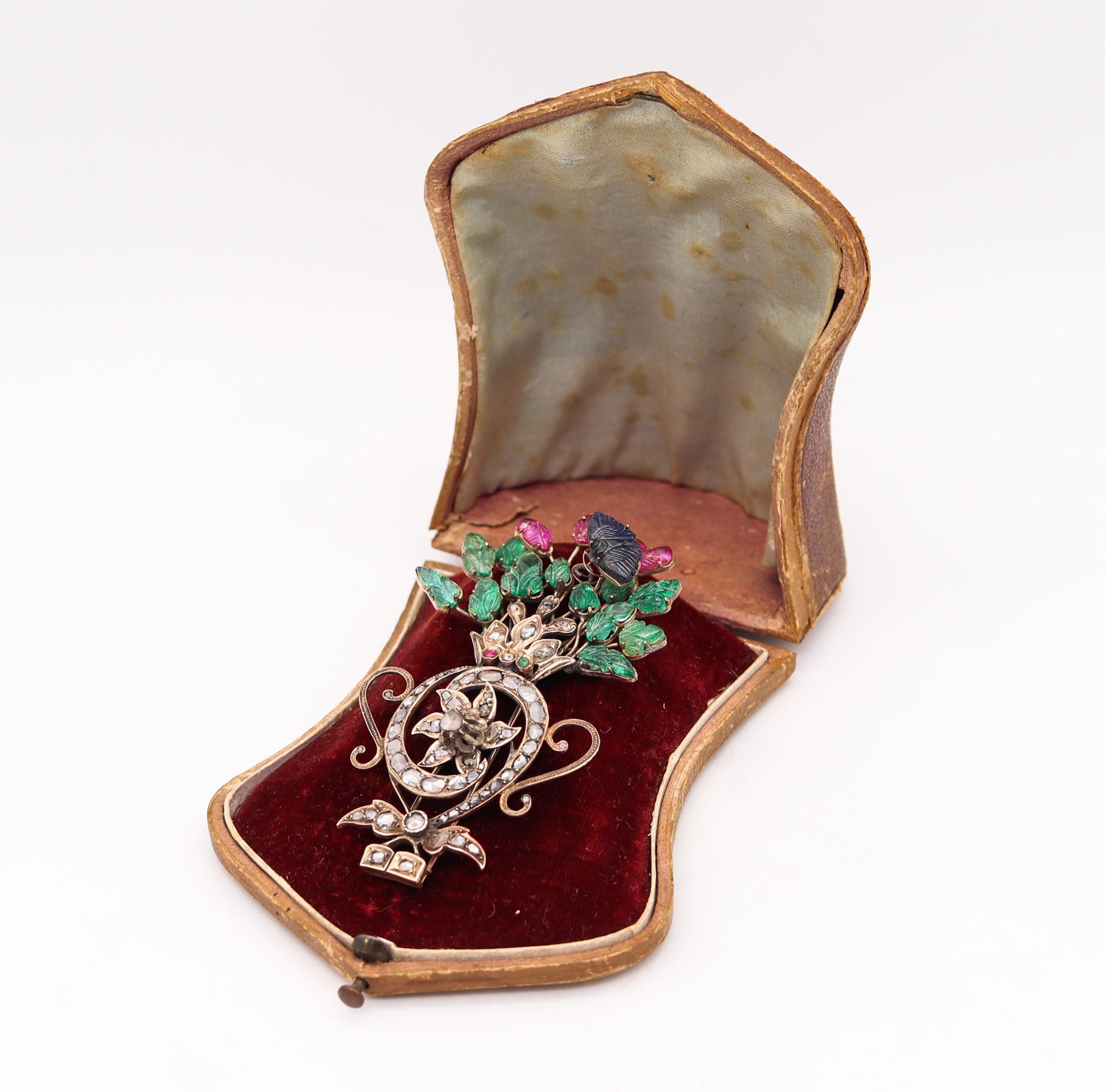Mughal tutti frutti jardiniere brooch with carved gemstones.

A beautiful colorful piece, created by the Mughals courts during the early Victorian era, circa 1830 or earlier. This unusual historical rare piece has been crafted in the shape of a