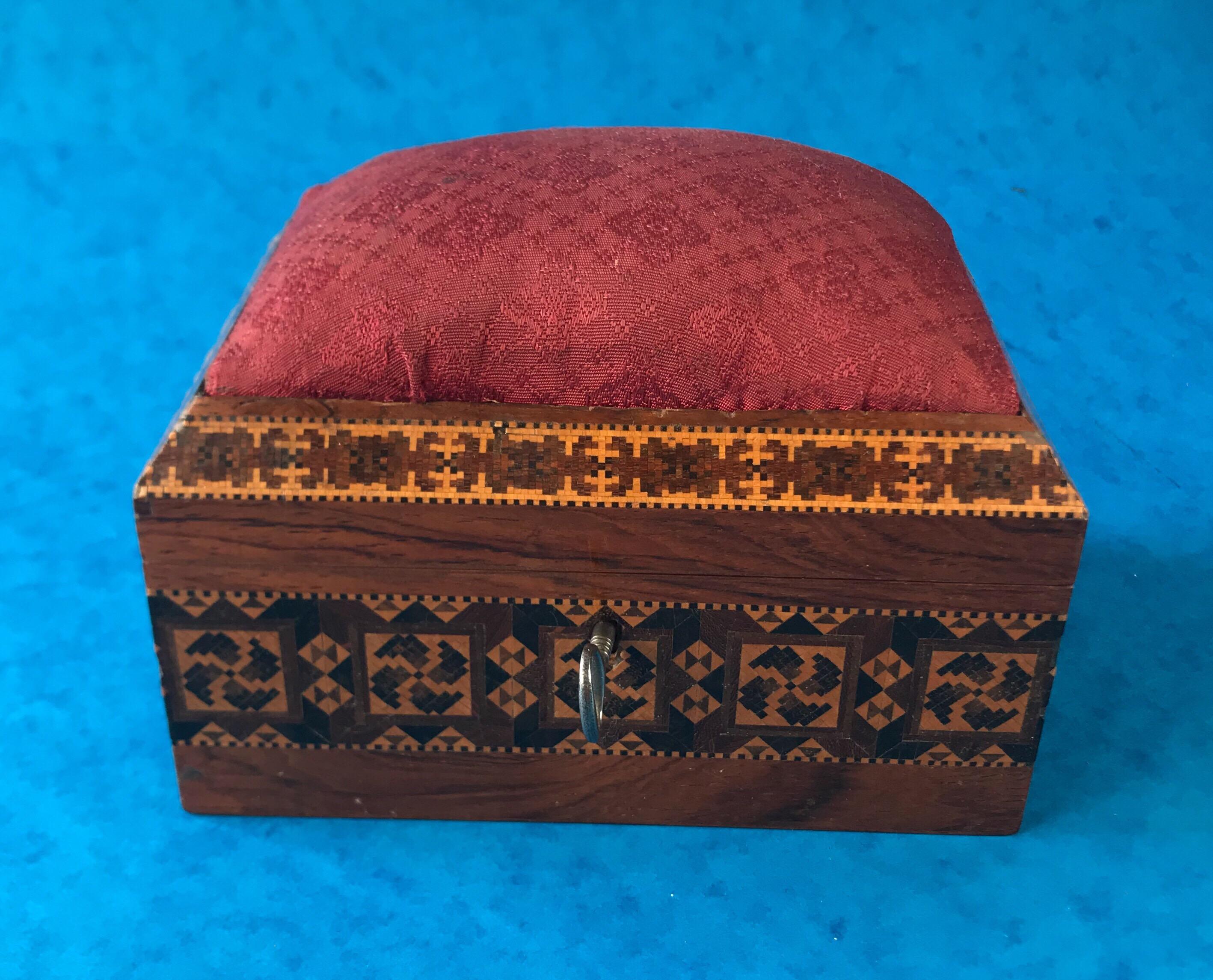 A Victorian 1845 Tunbridge Ware, stickware and mosaic sewing box, it has a red cushion top a working lock and key and its original interior. It measures 16 by 10.5 and stands 15 cm high.


