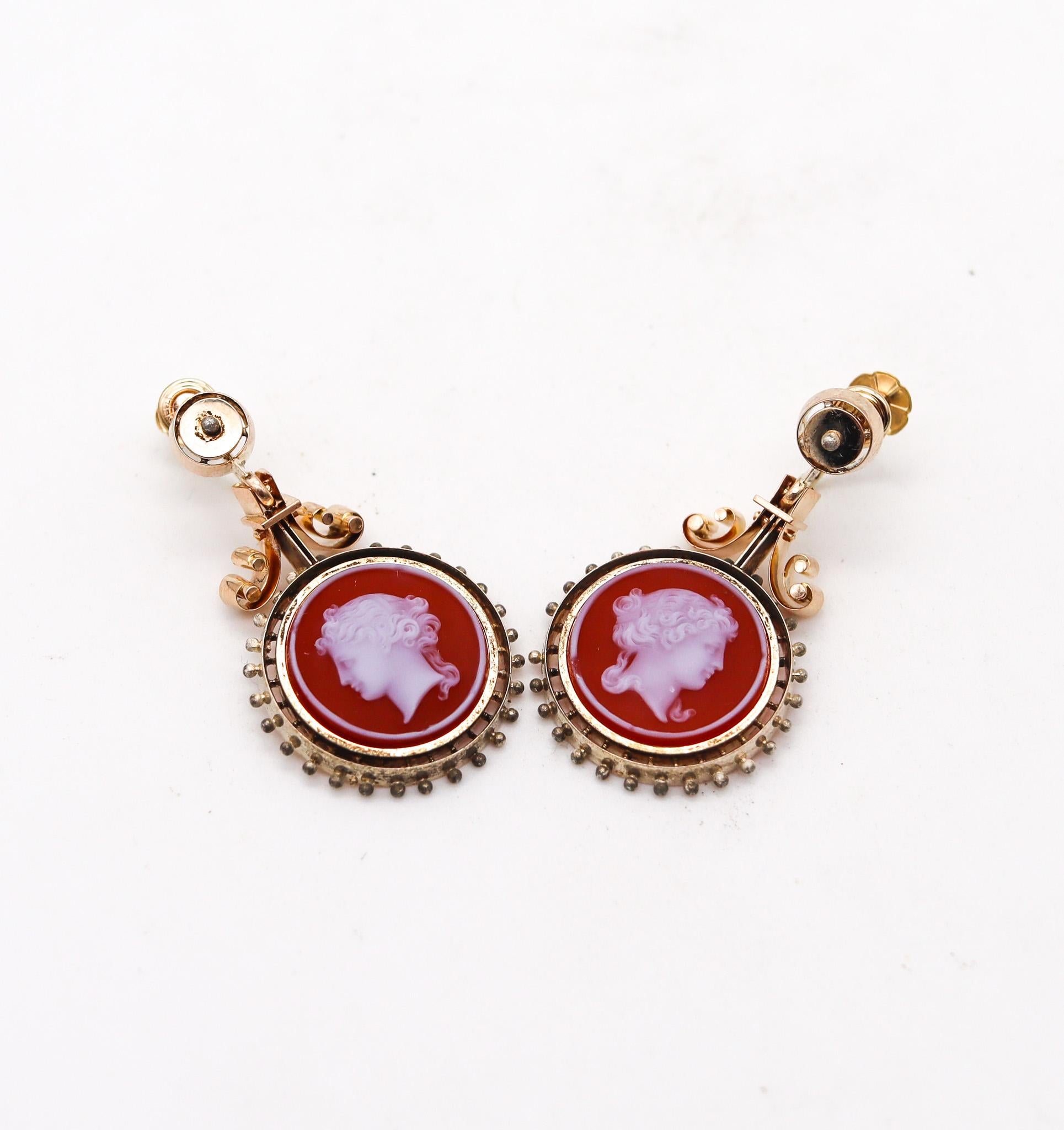 Victorian Etruscan Revival dangle drop earrings.

Beautiful antique dangle drops earrings, created in England during the Victorian Era (1837-1901), circa 1850. This pair of earrings has been made up with intricate Etruscan revival patterns of