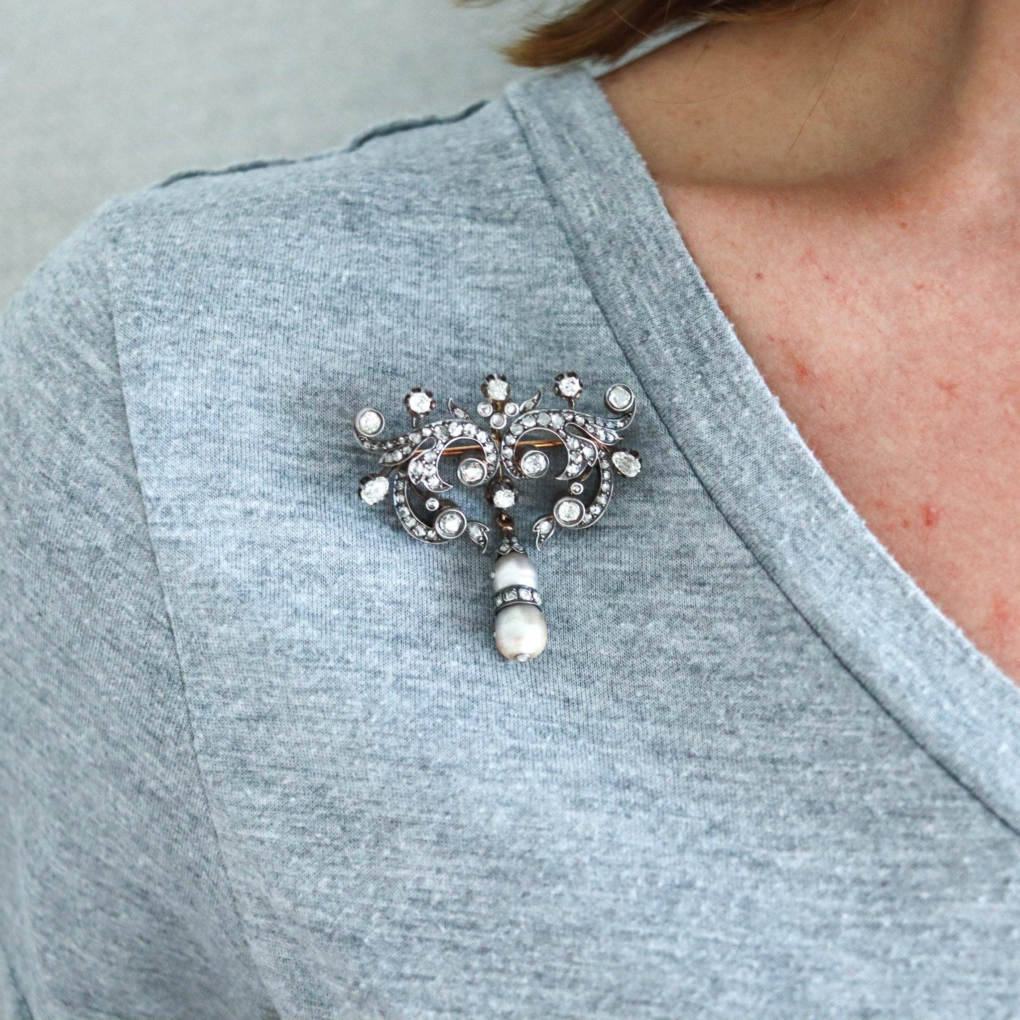 An antique early Victorian brooch with natural pearls

This is a beautiful corsage brooch created in England during the very early Victorian period, back in the 1840-1850. The fabulous brooch has been crafted with multiples scrolls in solid yellow