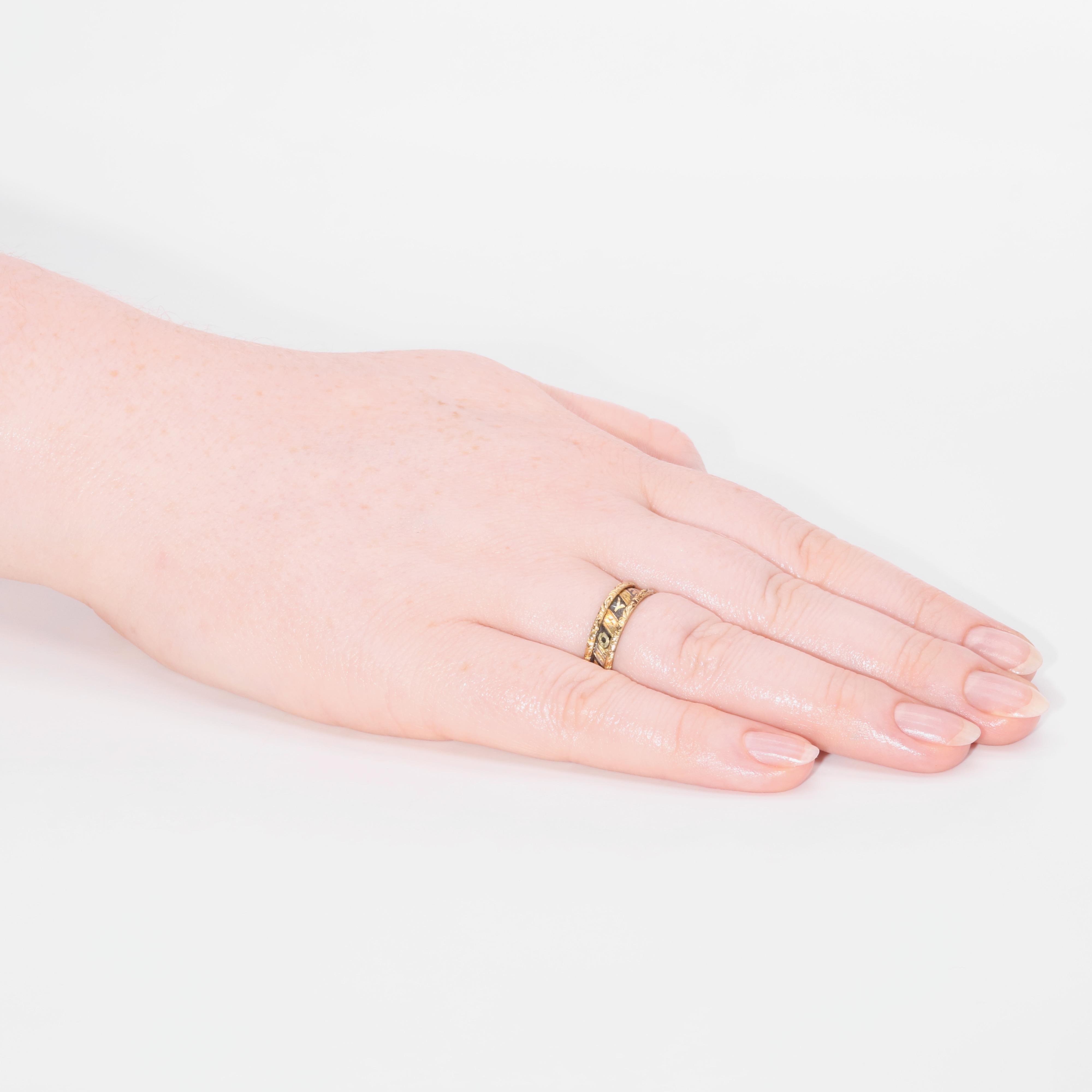 A Victorian black enamel and yellow gold ring, comprising black enamelled panels, reading “In Memory Of”, with engraving and carved floral edges, in 18 karat yellow gold. 

This meaningful band ring sports beautiful carved edges to the band. These