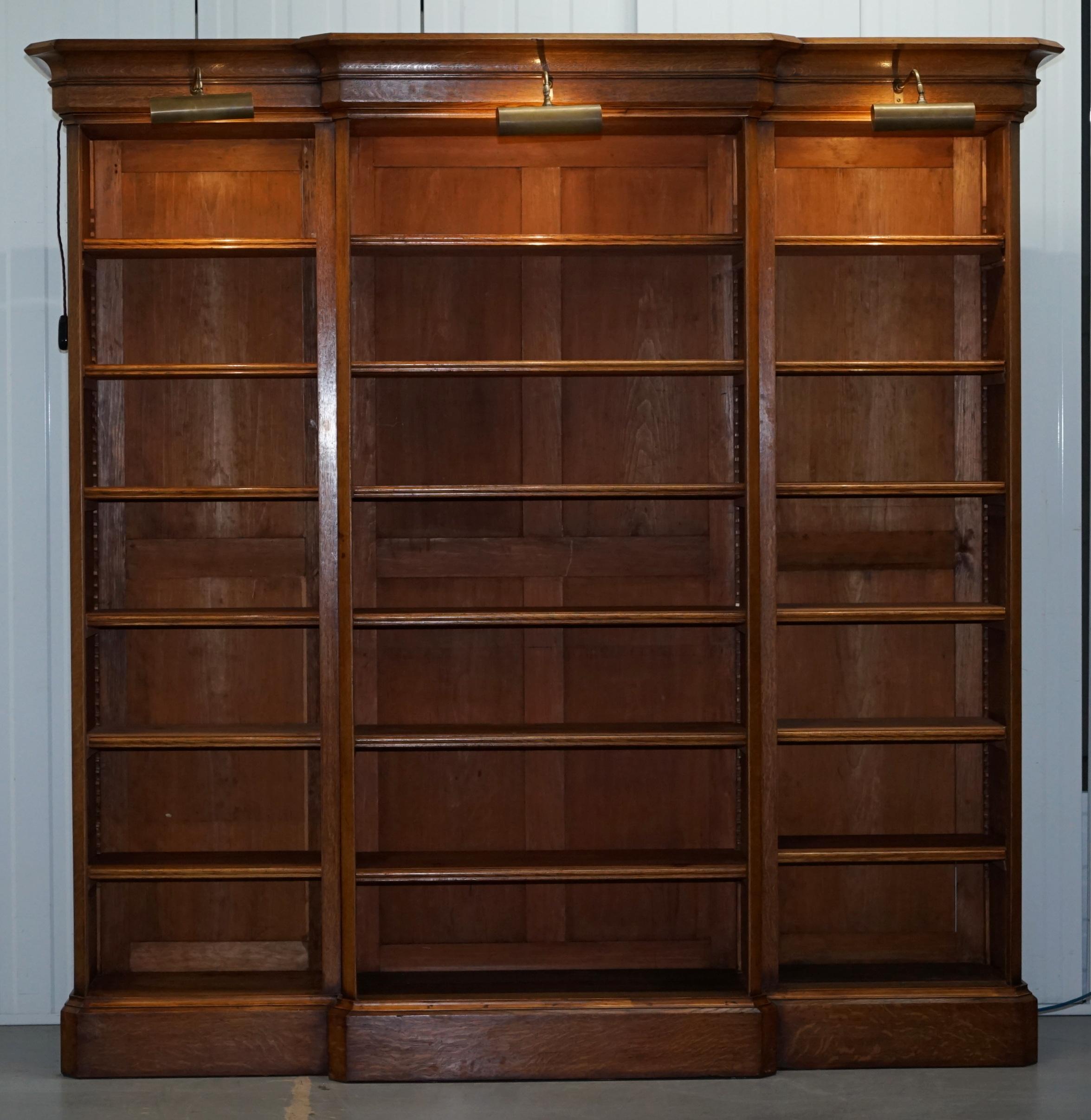 We are delighted to offer for sale this very important looking Victorian Oak Breakfront Library bookcase with three lights

A fantastically well made piece, the shelves are all removable and or height adjustable from top to bottom, the bookcase
