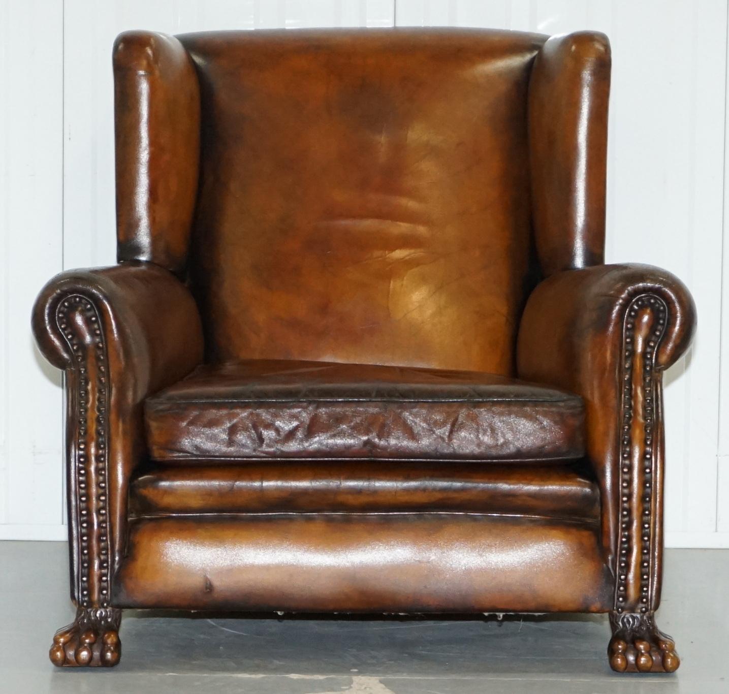 We are delighted to offer for sale this very rare original circa 1860 fully sprung restored aged brown leather lounge wingback armchair with lion hairy paw feet.

A very fine example, the feet are carved in the Georgian Irish manor and are