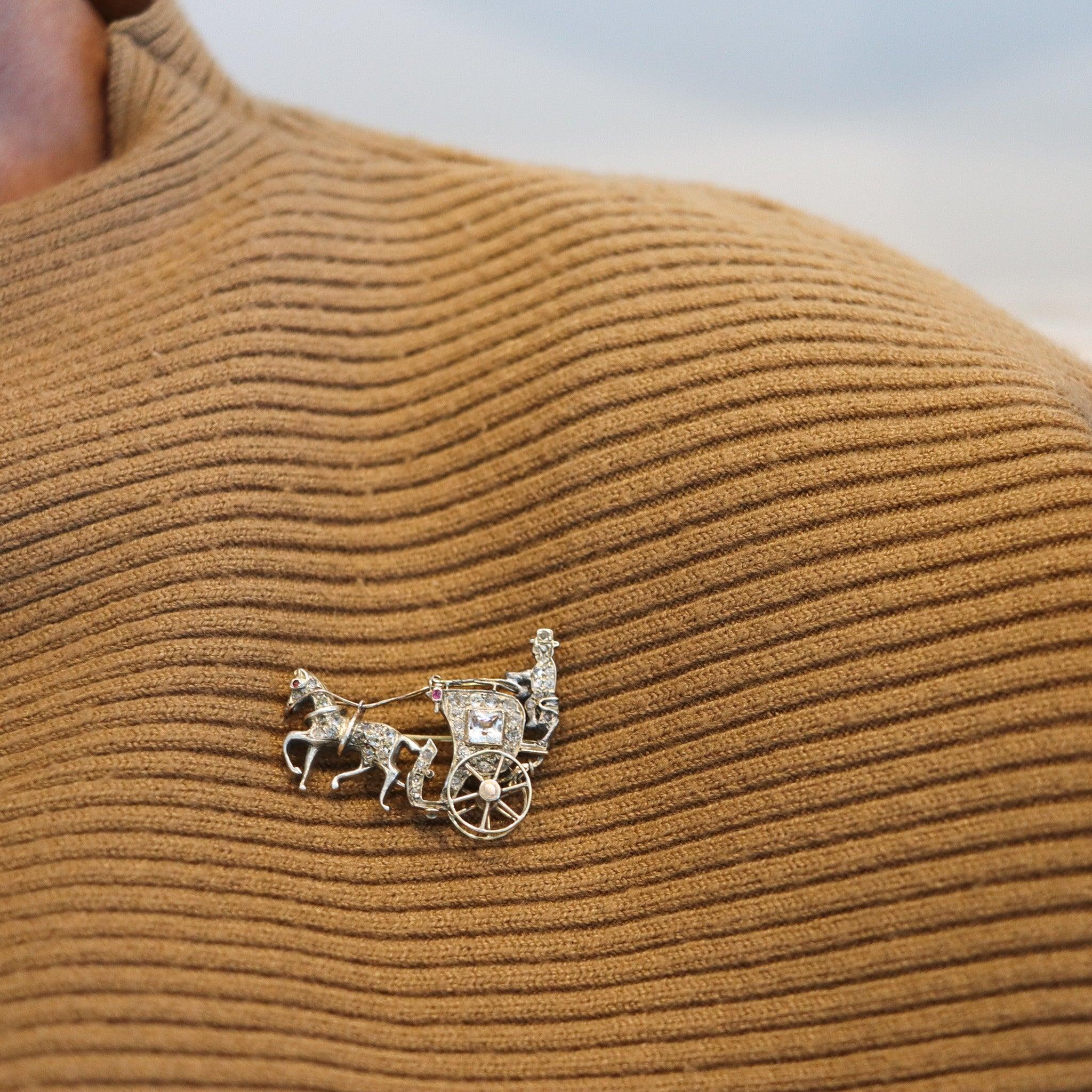 Victorian carriage brooch with diamonds.

This is a beautiful antique brooch created in Europe during the Victorian period, back in the 1870. The brooch has been designed in the shape of a carriage with a horse, masterfully crafted in yellow gold of