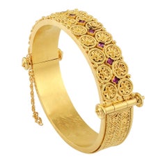 Victorian 1870s Etruscan Revival Ruby Gold Hinged Bangle