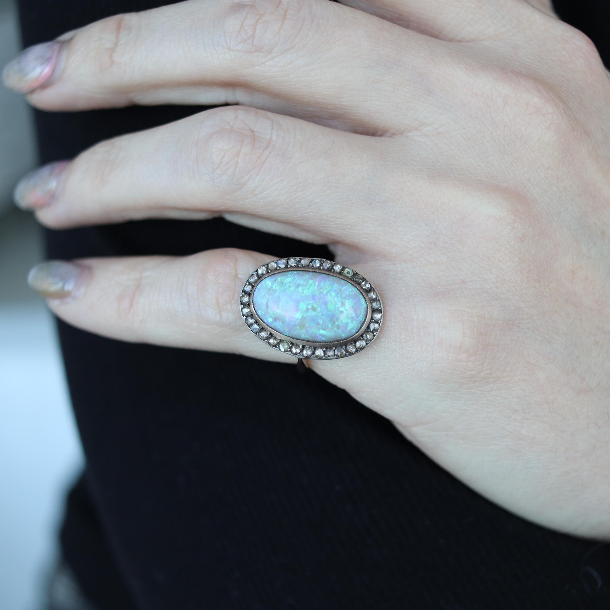 Victorian classic cocktail ring with opal.

Gorgeous antique ring, created during the Victorian period in England, back in the 1880. The beautiful statement cocktail ring has been designed with classic patterns in an oval shape. It was crafted in
