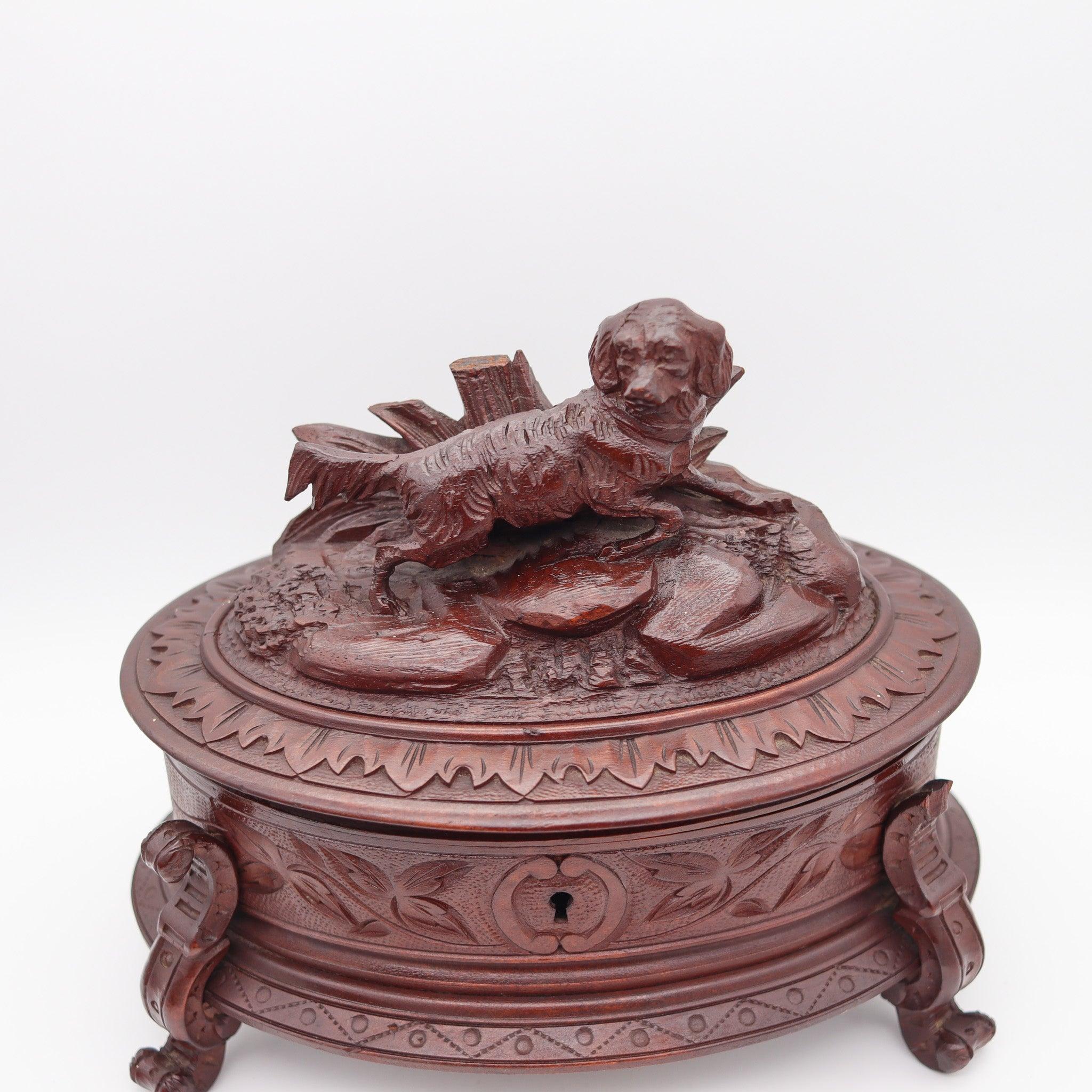 Late Victorian carved wood oval box.

Stupendous antique oval desk box, created in England during the late Victorian period, circa 1880. The beautiful box has been carefully carved in dark brown wood and decorated with organic floriated designs. The
