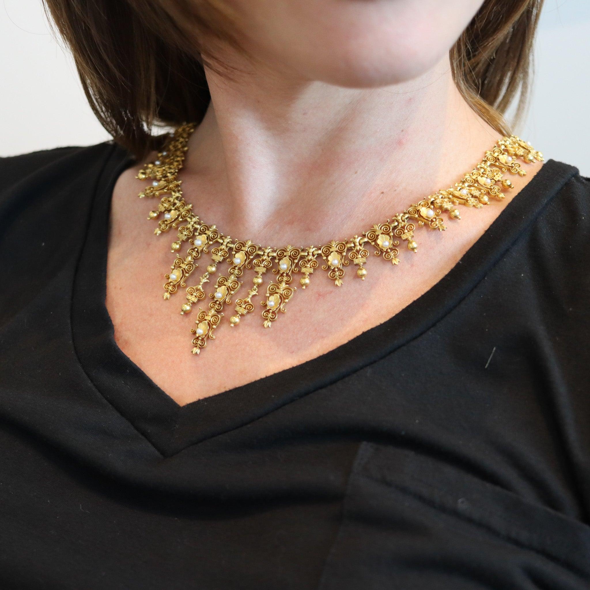Victorian 19th century Neo-Gothic Etruscan Necklace.

This is a magnificent and exceptional antique necklace, created in England during the late Victorian era (1840-1901), back in 1880. The delicate necklace was carefully crafted with mixed