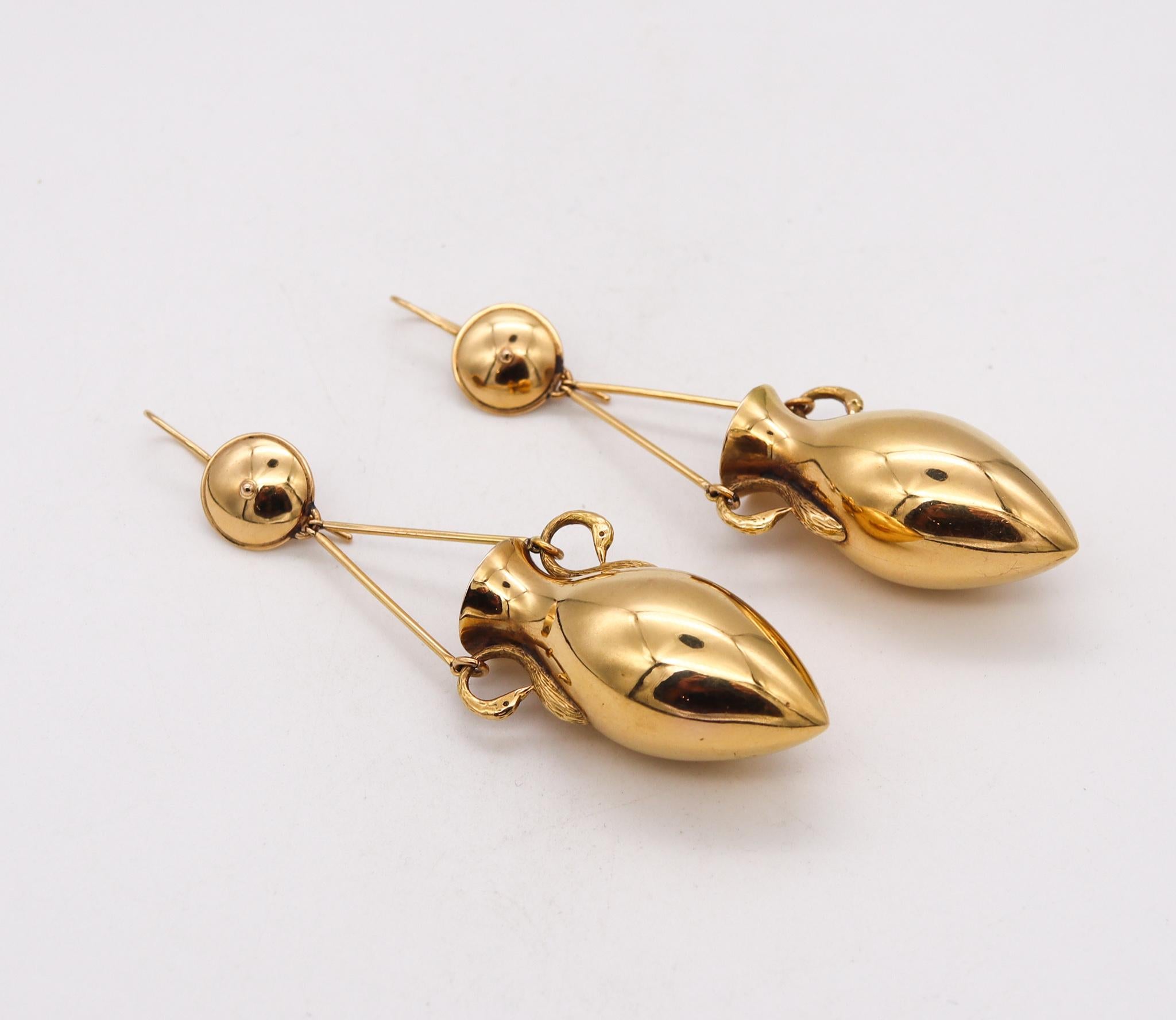 Etruscan-Roman revival ear drops pendants.

Magnificent oversized drop earrings, from the Victorian Era (1837-1901) circa 1880. These beautiful pair has been crafted with etruscan-roman revival patterns in solid yellow gold of 18 karats, with high