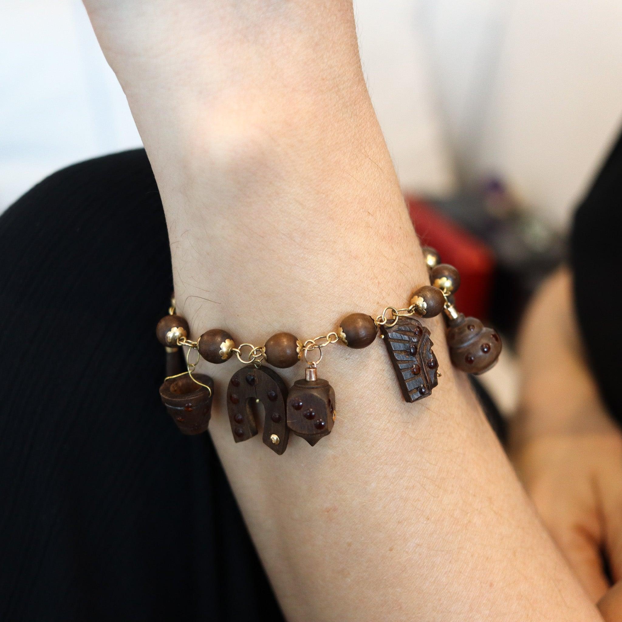 An exceptional Victorian charms bracelet in wood.

This is a fabulous and very rare charms bracelet, created in London England during the Victorian period, back in 1880. The exceptional bracelet is very unusual and is composed of eight charms of
