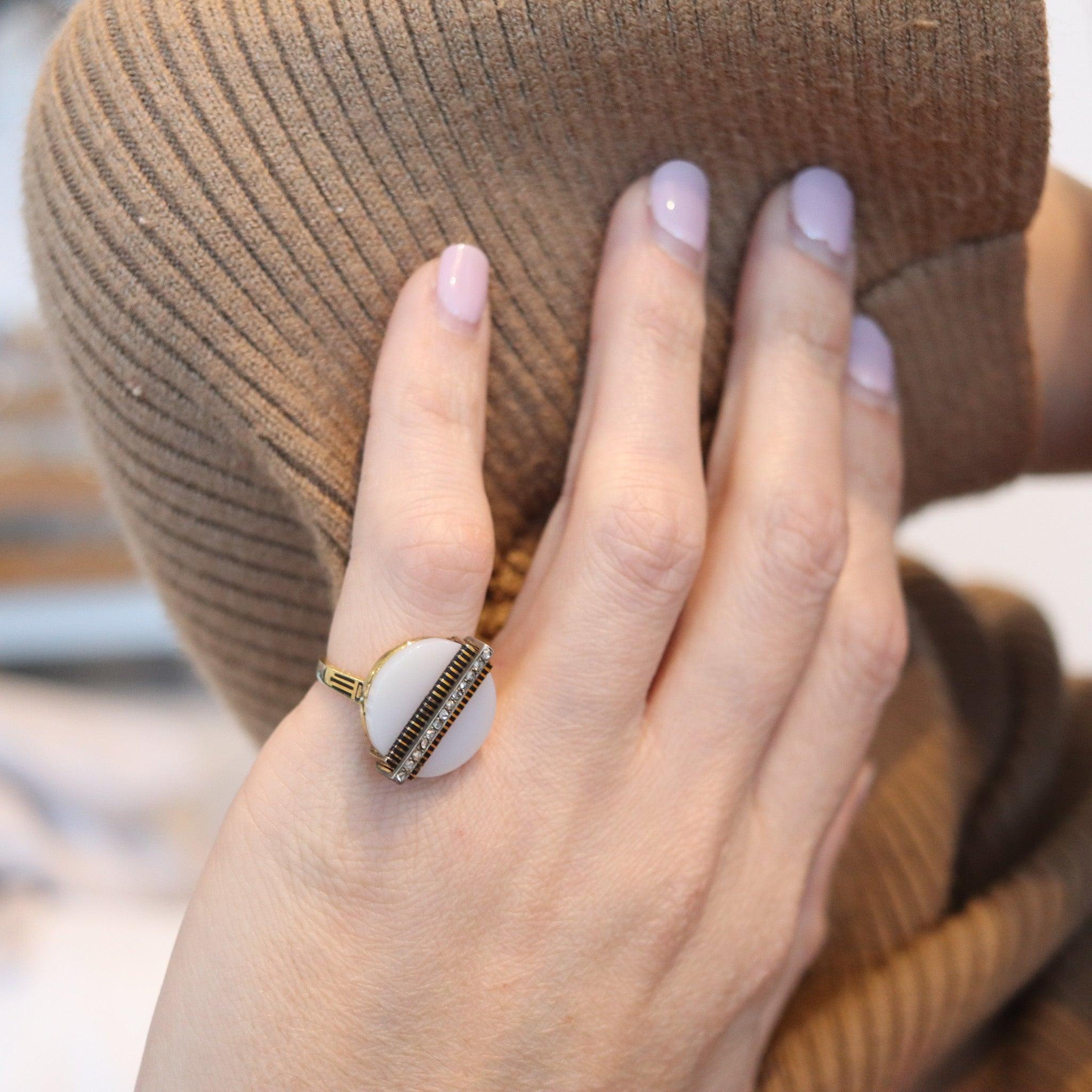 Victorian industrialism cocktail ring with a agate

This is an industrial-shaped cocktail ring created in England during the late Victorian period, between the 1870 and 1880. The unusual ring has been crafted with a mechanical machine look in solid
