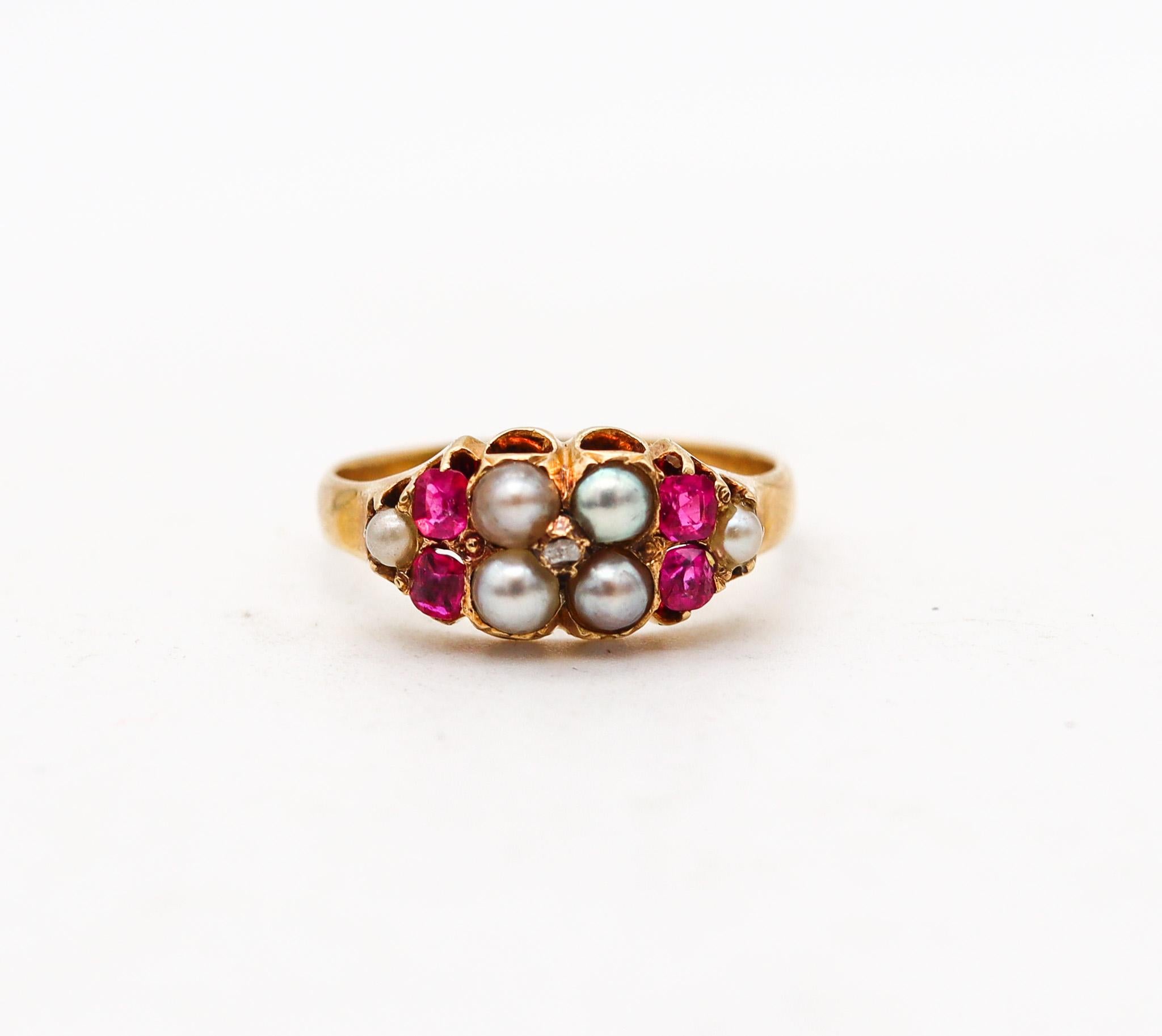 An European Victorian ring with rubies and pearls.

Beautiful and delicate antique ring, created in Europe back in the 19th century, circa 1880. This ring is most probably British and has been crafted in solid yellow gold of 18 karats with high