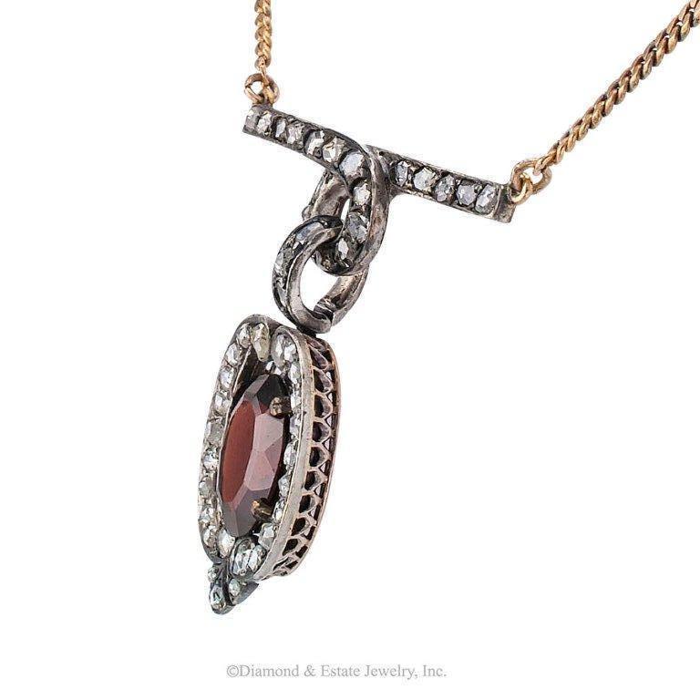 Victorian 1880s Garnet Rose-cut Diamond Gold Silver Necklace

Victorian 1880s garnet and rose-cut diamond necklace mounted in silver over gold.  The articulated design features an oval garnet and forty-seven rose-cut diamonds totaling approximately