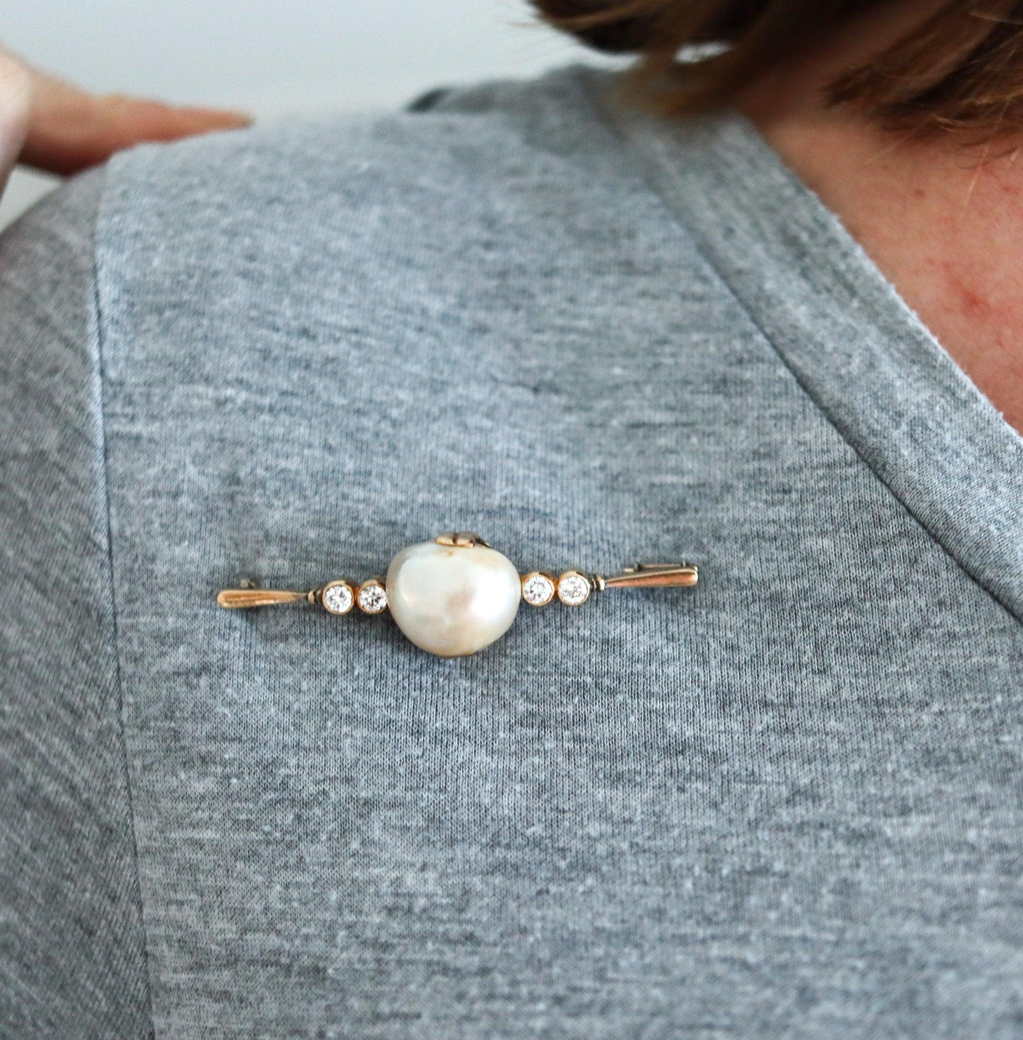 An antique Victorian brooch with natural pearl

This is a beautiful bar brooch created in England during the Victorian period, back in the 1890-1900. The elegant brooch has been crafted in solid yellow gold of 14 karats with polished finish and is