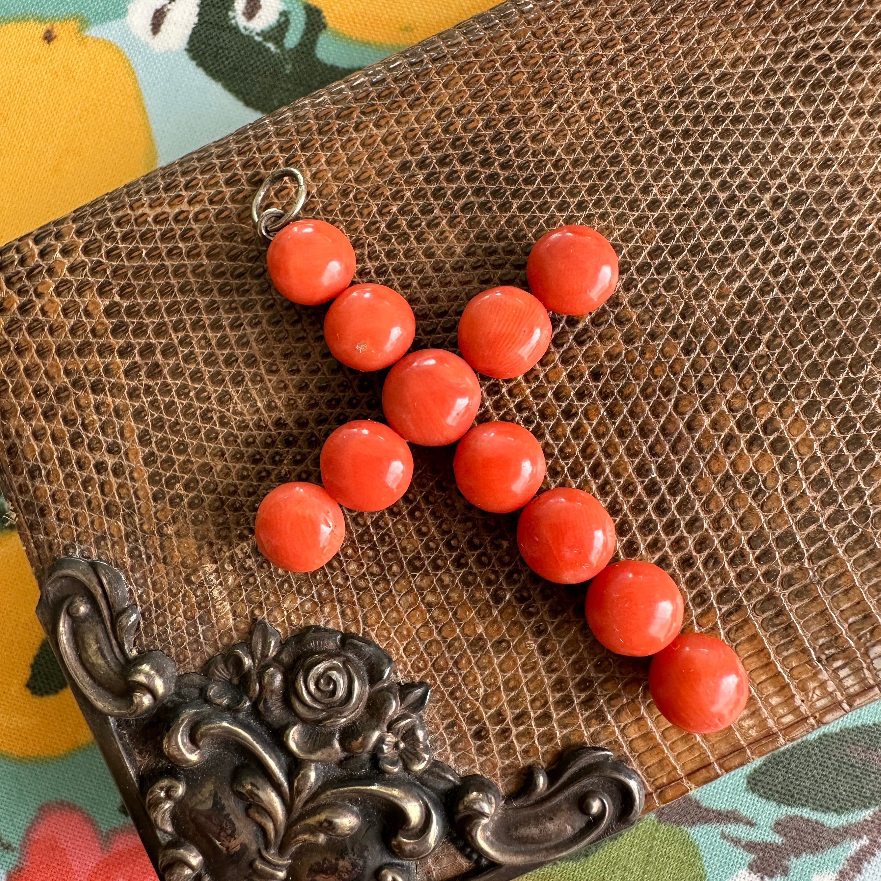 Details:
Stunning Victorian natural red coral and silver cross.  The amazingly matched cabochon coral is a lovely bright red/orange color. Dating from late 1890-1900, this cross is absolutely lovely. The cross measures 2 1/4