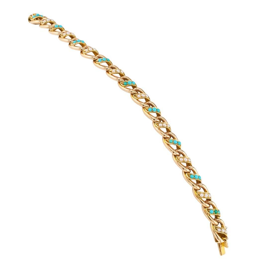 Victorian 1890s turquoise pearl and gold link bracelet. Comprising a series of moderately twisted, elongated oval links, each decorated at the center by alternating, scrolling motifs set with trios of seed pearls and circular turquoise cabochons,