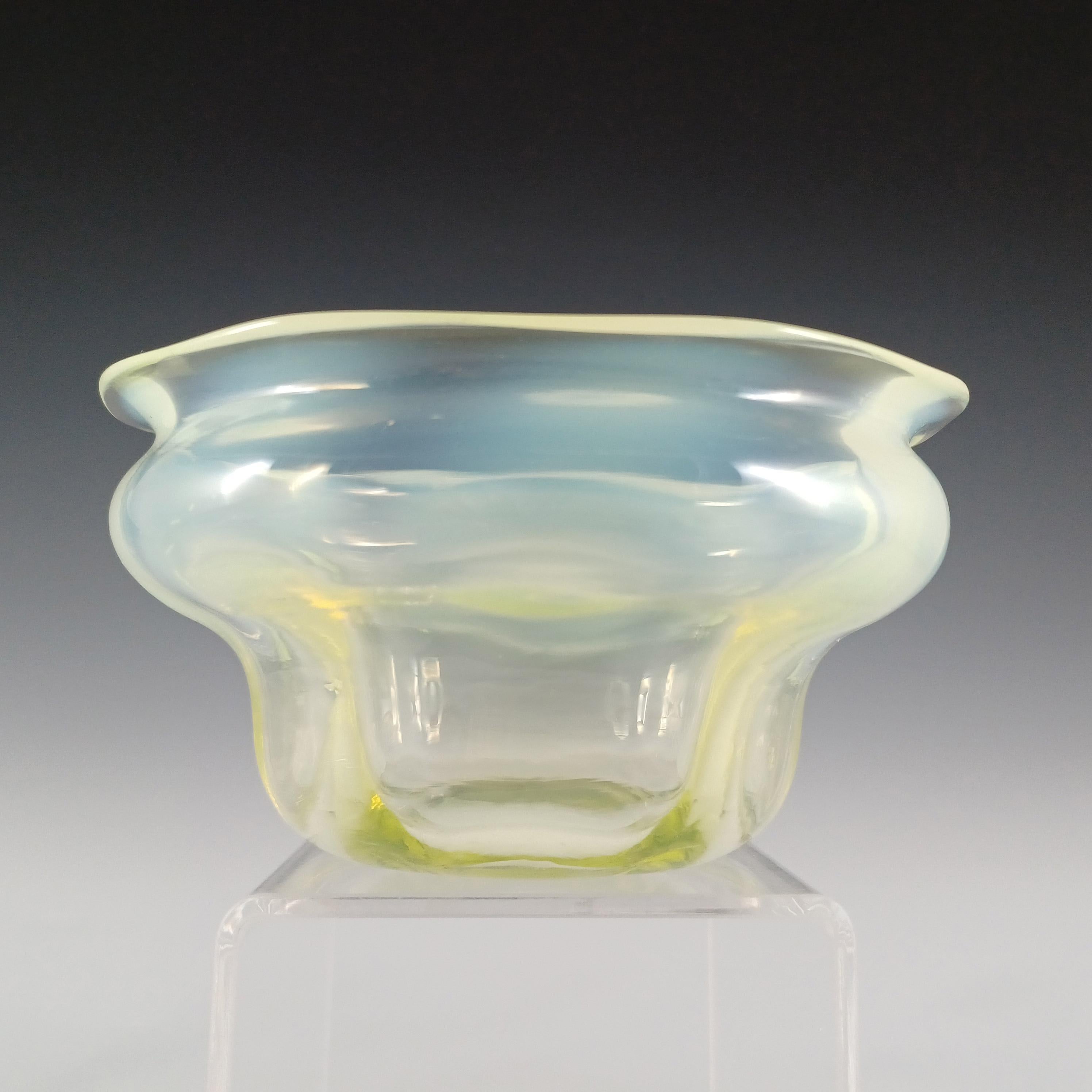 A wonderful Victorian yellow green vaseline glass bowl, with opalescent patches, circa 1890's. Made in uranium glass, which glows bright green in UV light. Probably English in origin. Quality ground and polished concave pontil mark to the