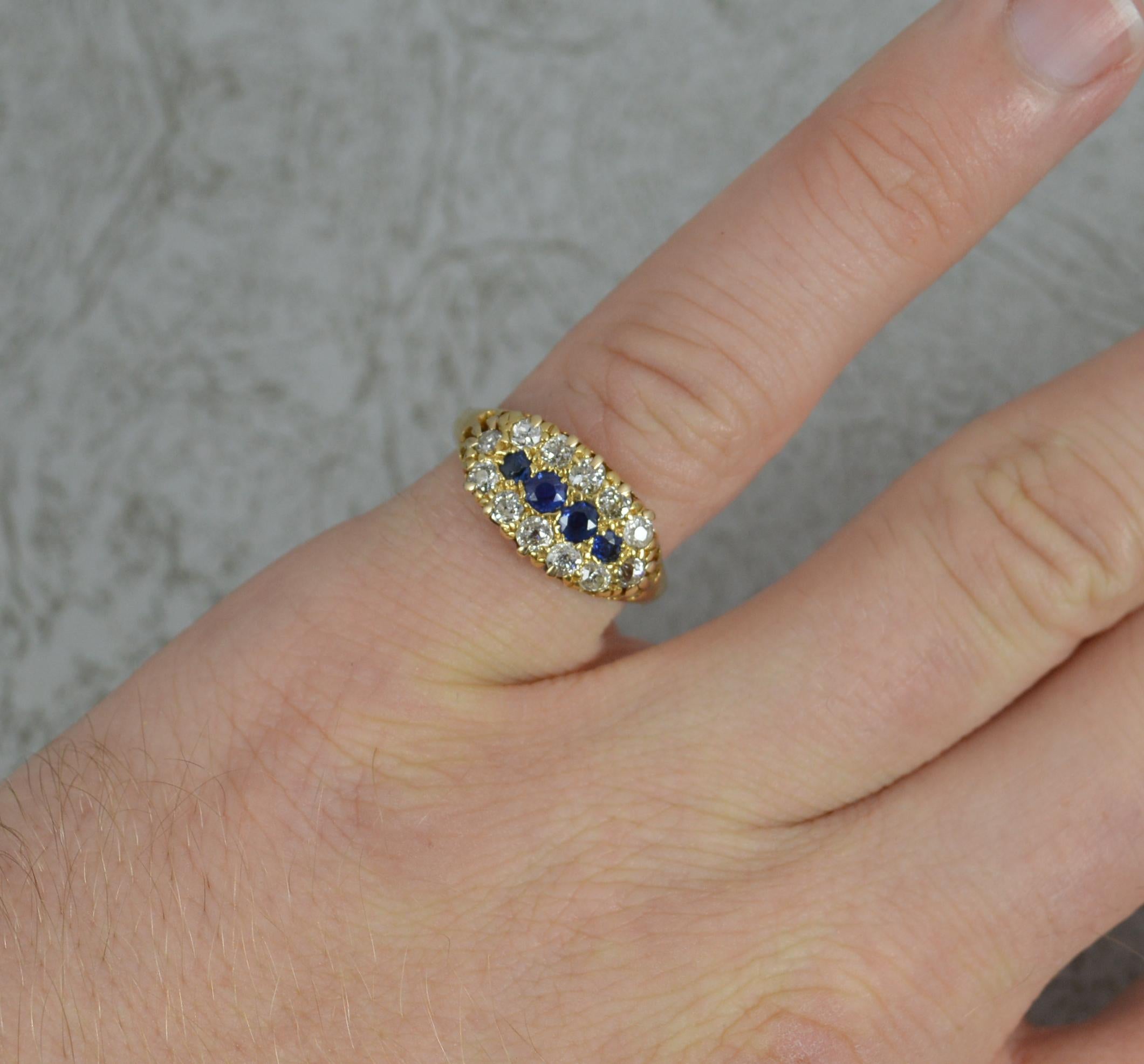 A stunning Sapphire and Diamond cluster ring.
Solid 18 carat yellow gold example.
The centre holds four natural blue sapphires with a full border of natural old cut diamonds.
14.7mm spread of stones. 8.5mm wide band.

CONDITION ; Very good. A