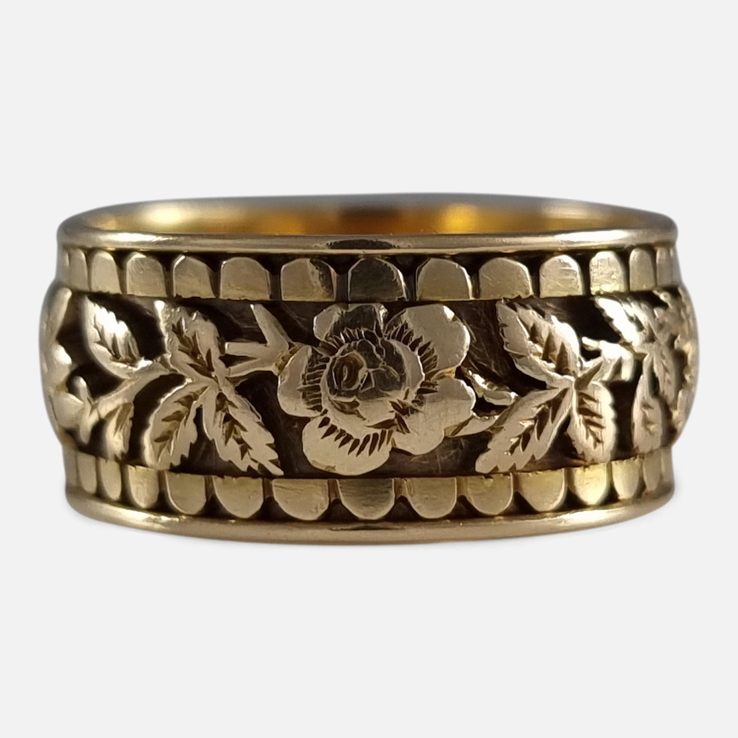 A Victorian 18ct yellow gold engraved Memorial ring. The ring is engraved with a foliate decoration to the exterior, and is inscribed to the interior 'Ellen Tuson, died March 13th 1894 Aged 75'.

The ring is hallmarked with Birmingham marks, '18'